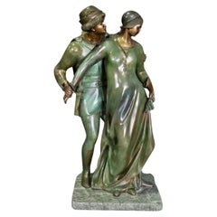 Superbe sculpture en bronze vert-de-gris signée Nene représentant un couple d'amoureux
