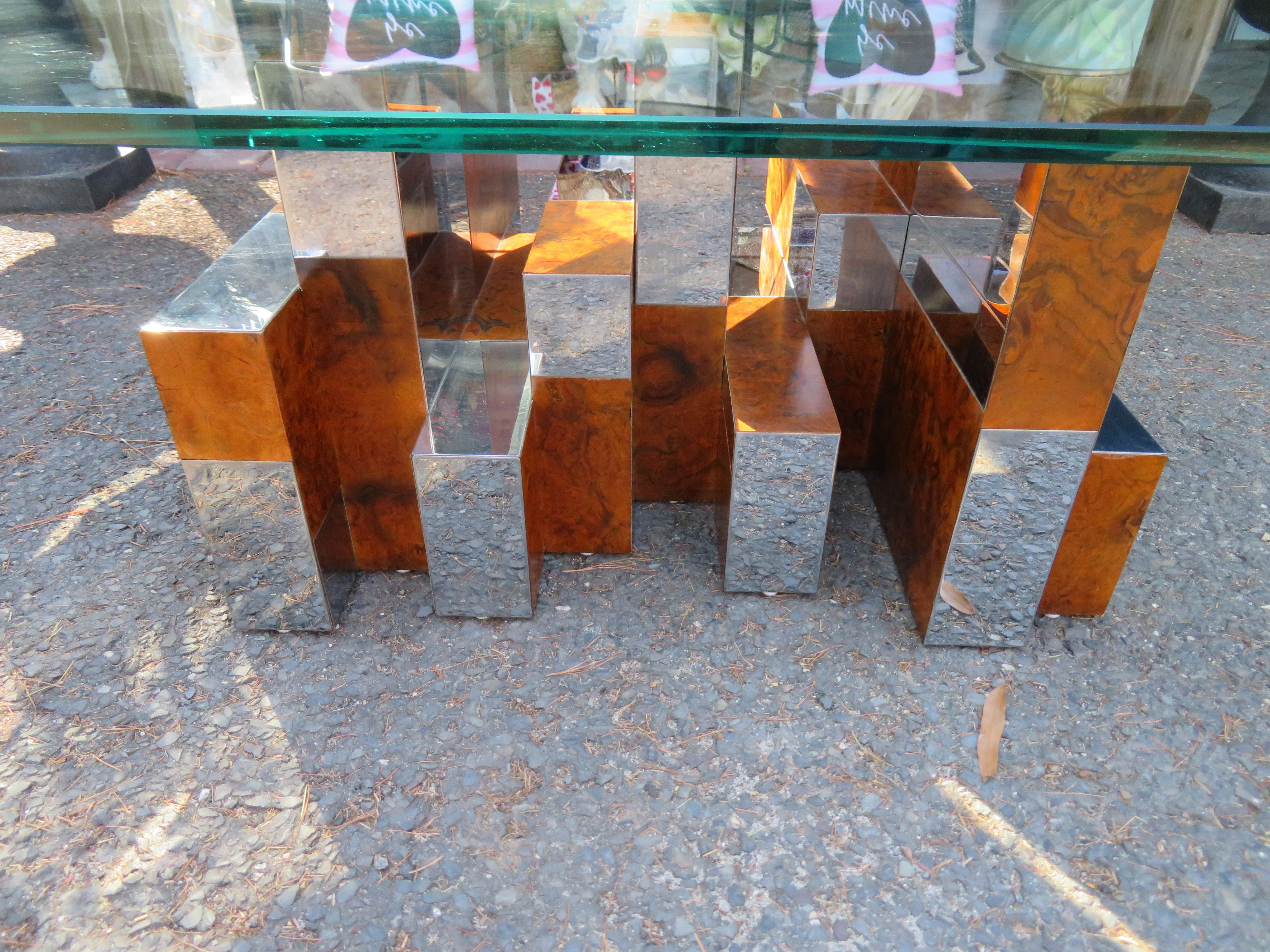 Stunning Cityscape coffee table with glass top by Paul Evans for Directional. Burl-Walnut alternates with chrome in this dynamic mid-70s design by Paul Evans. Very nice original condition with only minor signs of age. 
Signed Paul Evans.
Base: