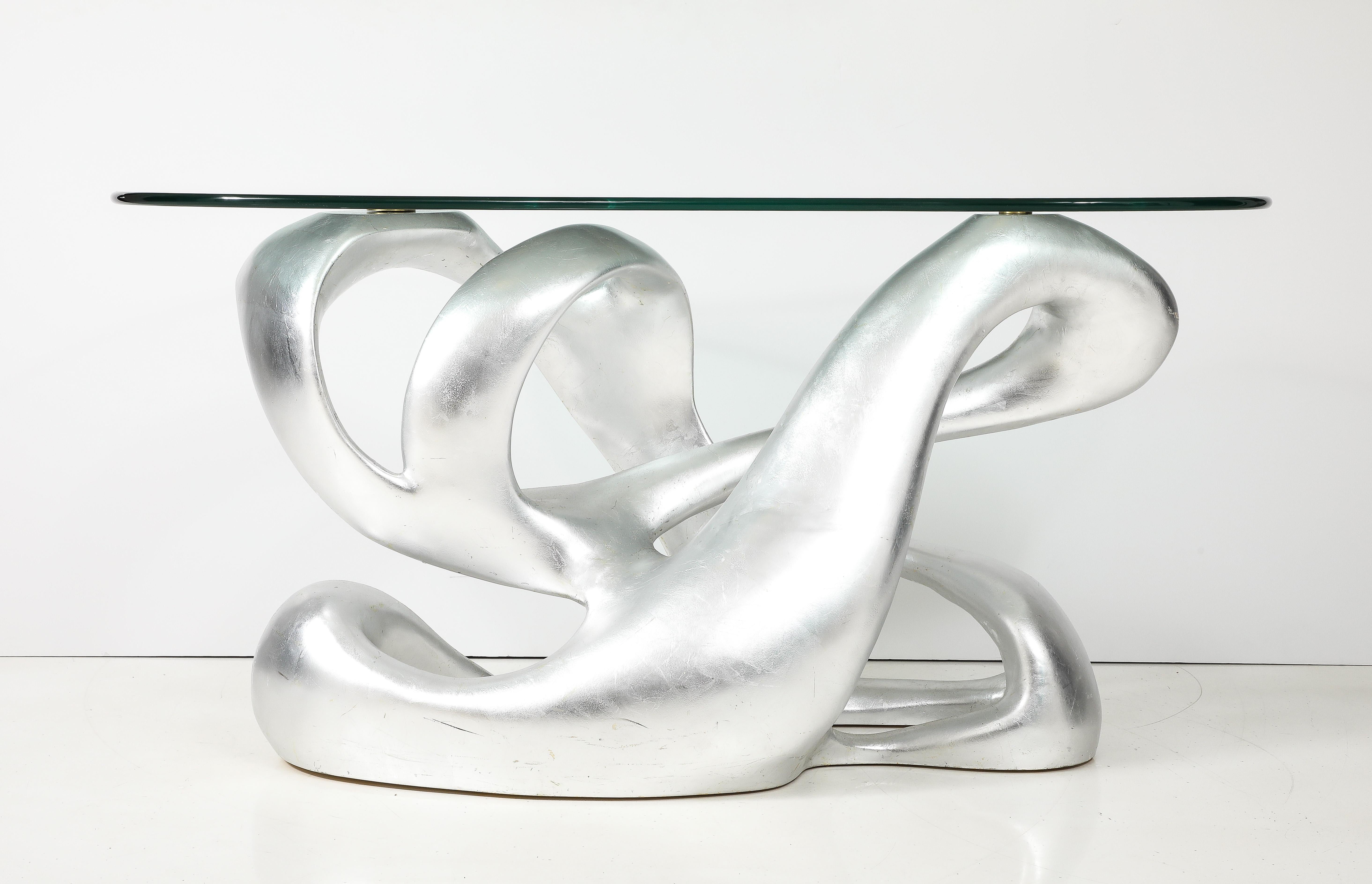 Stunning  Biomorphic silver leaf console designed by Tony Duquette, reissued in a limited amount by Baker furniture company.

The console was originally designed for the Charles and Palmer Ducommum
Bel Air residence in the 1960's 
Baker reissued the