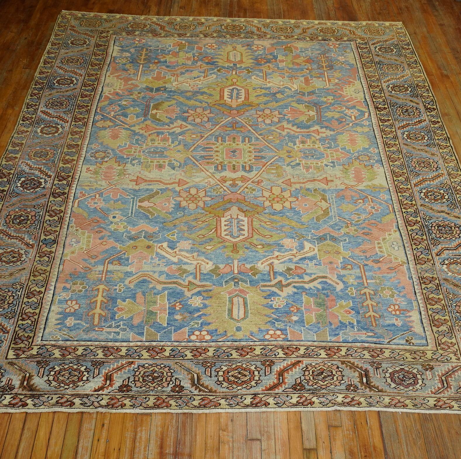 Stunning sky blue field early 20th century decorative Persian Heriz. The border is a light blue too, accents with a striking celery green accent color. Not your ordinary traditional Persian Heriz.

Measures: 9'3'' x 12'.