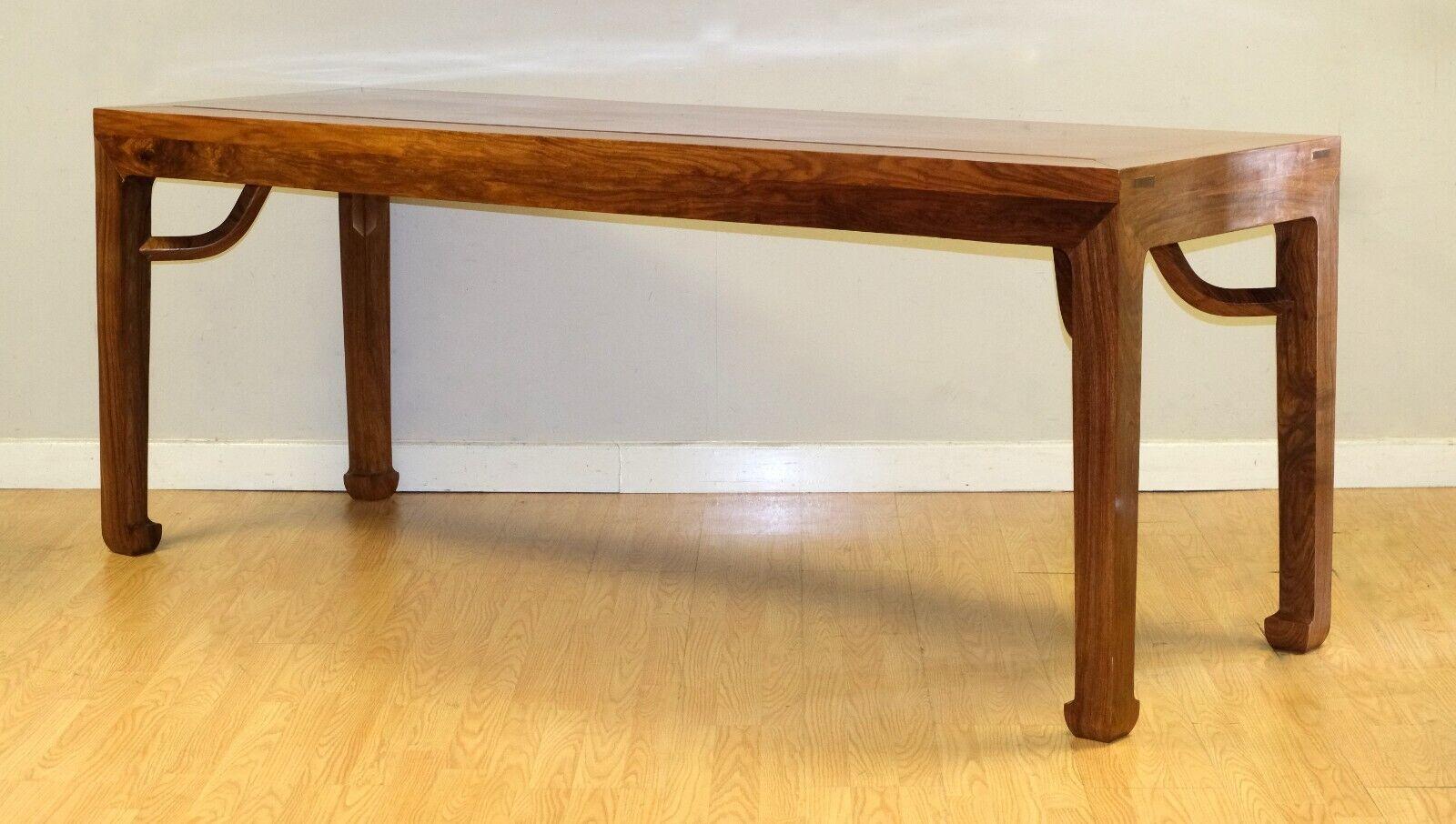 We are delighted to offer for sale this stunning Ming Elmwood dining table raised on horse hoof solid feet.

This chunky but stylish piece is simple eye catching from any angle. The horse feet has S shape supports, all fitted into the underside of