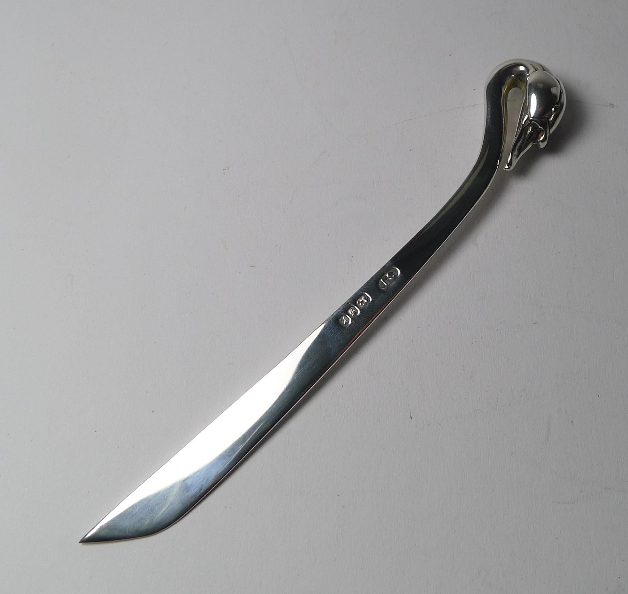 A wonderful top quality letter opener by the well renowned modern silversmith, Sarah Jones.

This beautiful example has a handle created from an elegant Swan's head with it's long neck blending into the opener's blade.

The silver is fully