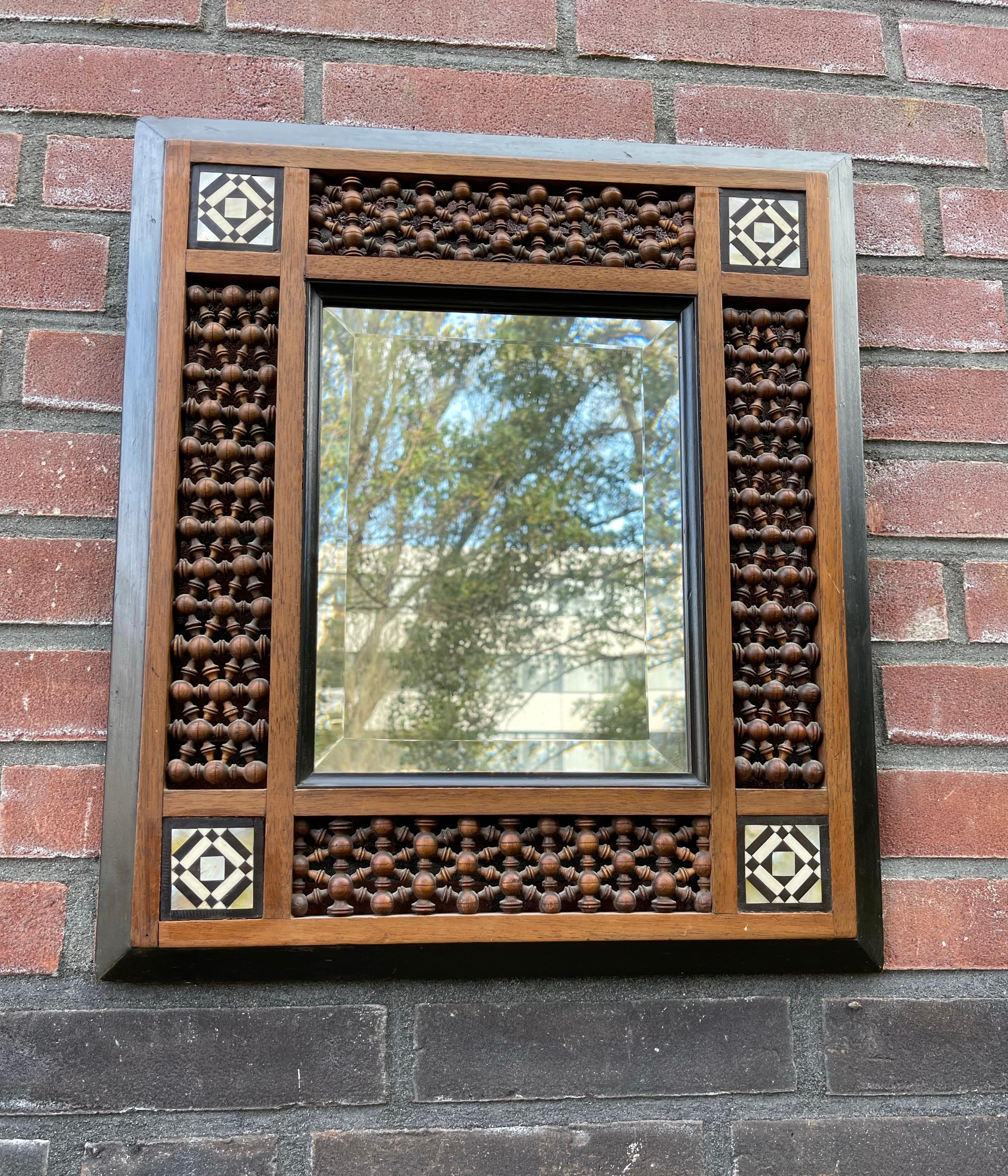 Early 1900s handcrafted wooden picture frame with beveled mirror, South Spanish 1900.

This rare and all handcrafted Alhambra style picture frame is in excellent condition and it comes with the original, antique beveled mirror. If you are