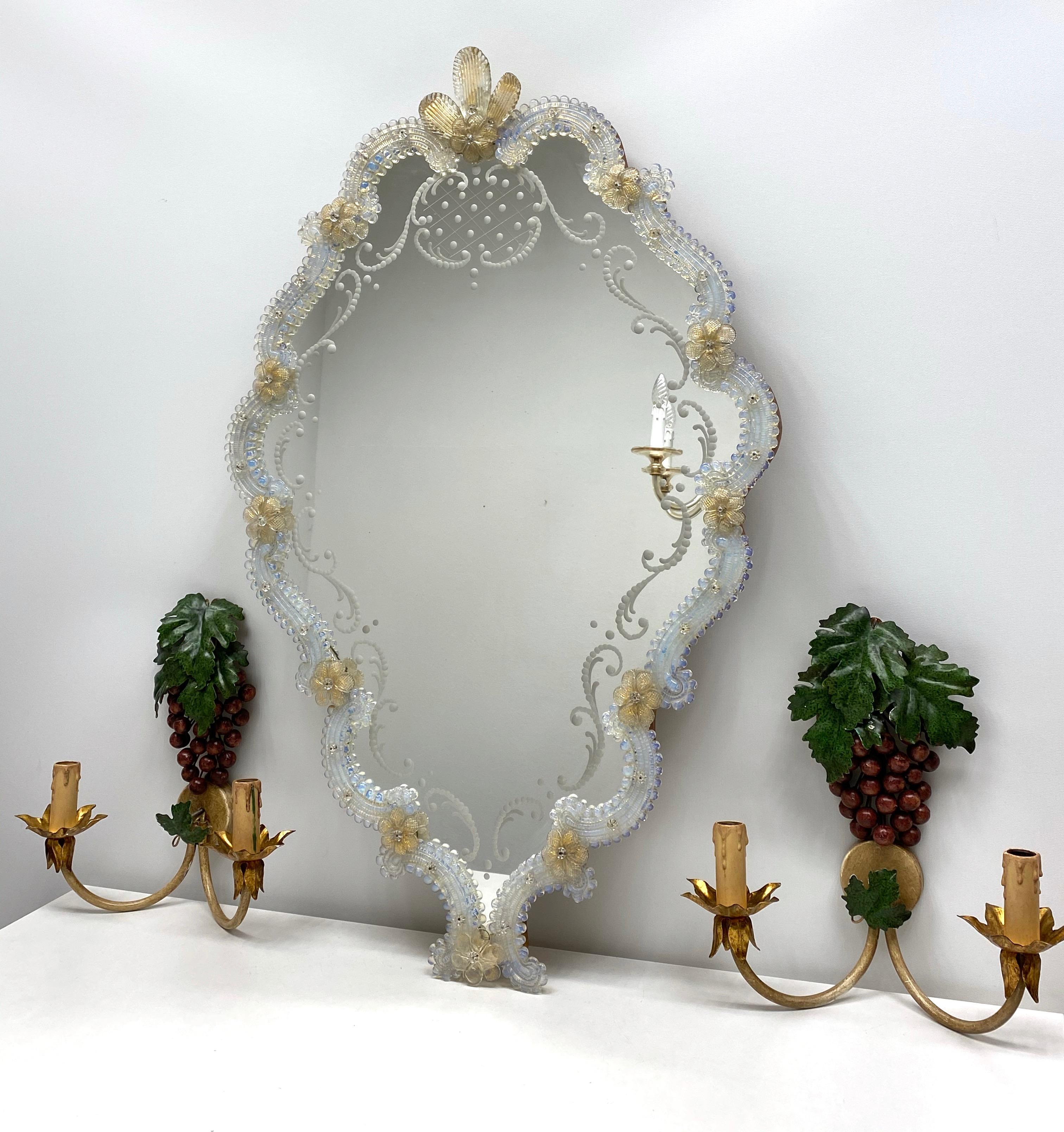 A stunning large Murano glass mirror surrounded with handmade glass flowers. Age circa 1950s. Some edged branches in the mirror. With signs of wear as expected with age and use. Obviously this item is not new, so please check all photos before
