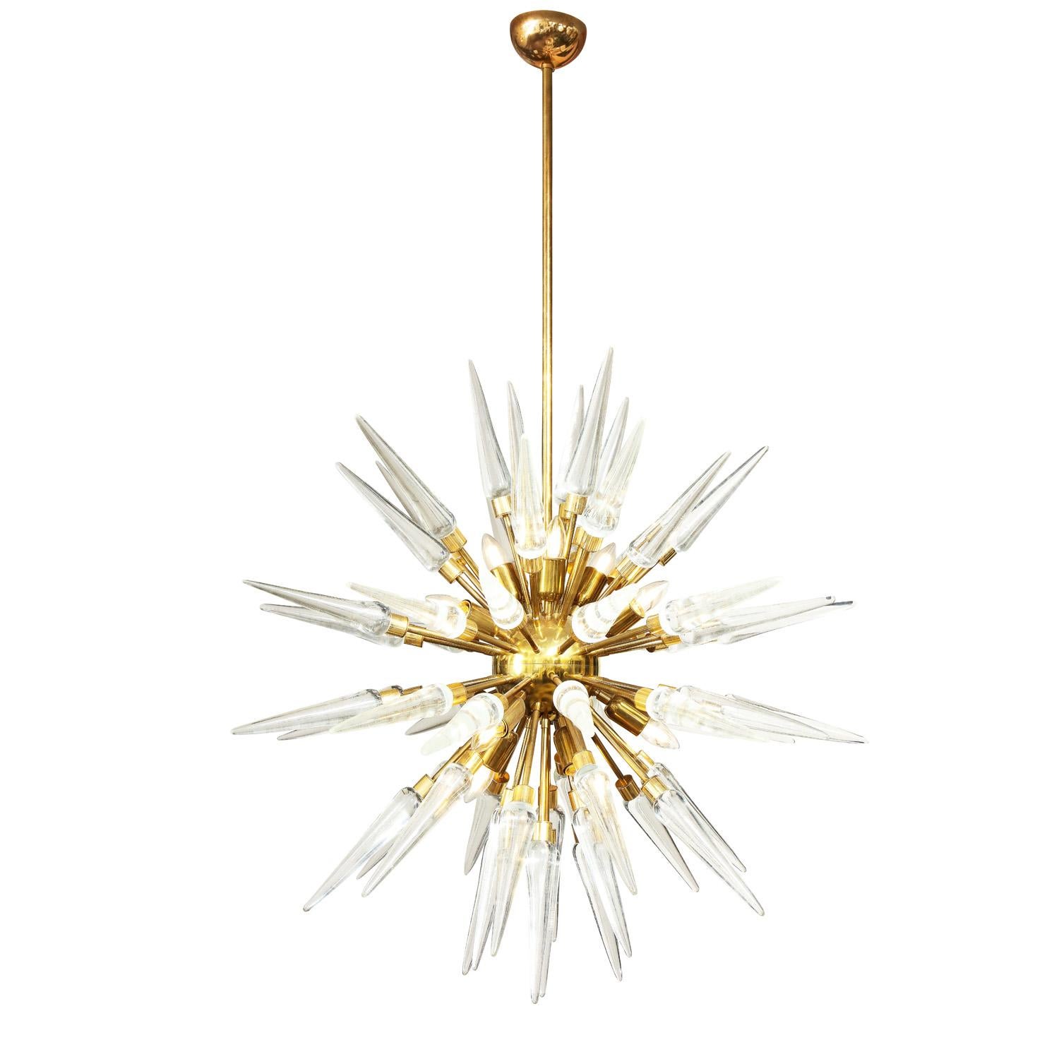 Custom Sputnik-style chandelier in polished brass with clear Murano Glass spikes. Italy 2022. This piece is currently available as shown in our NYC showroom. For custom sizes and finishes please inquire with Venfield.
