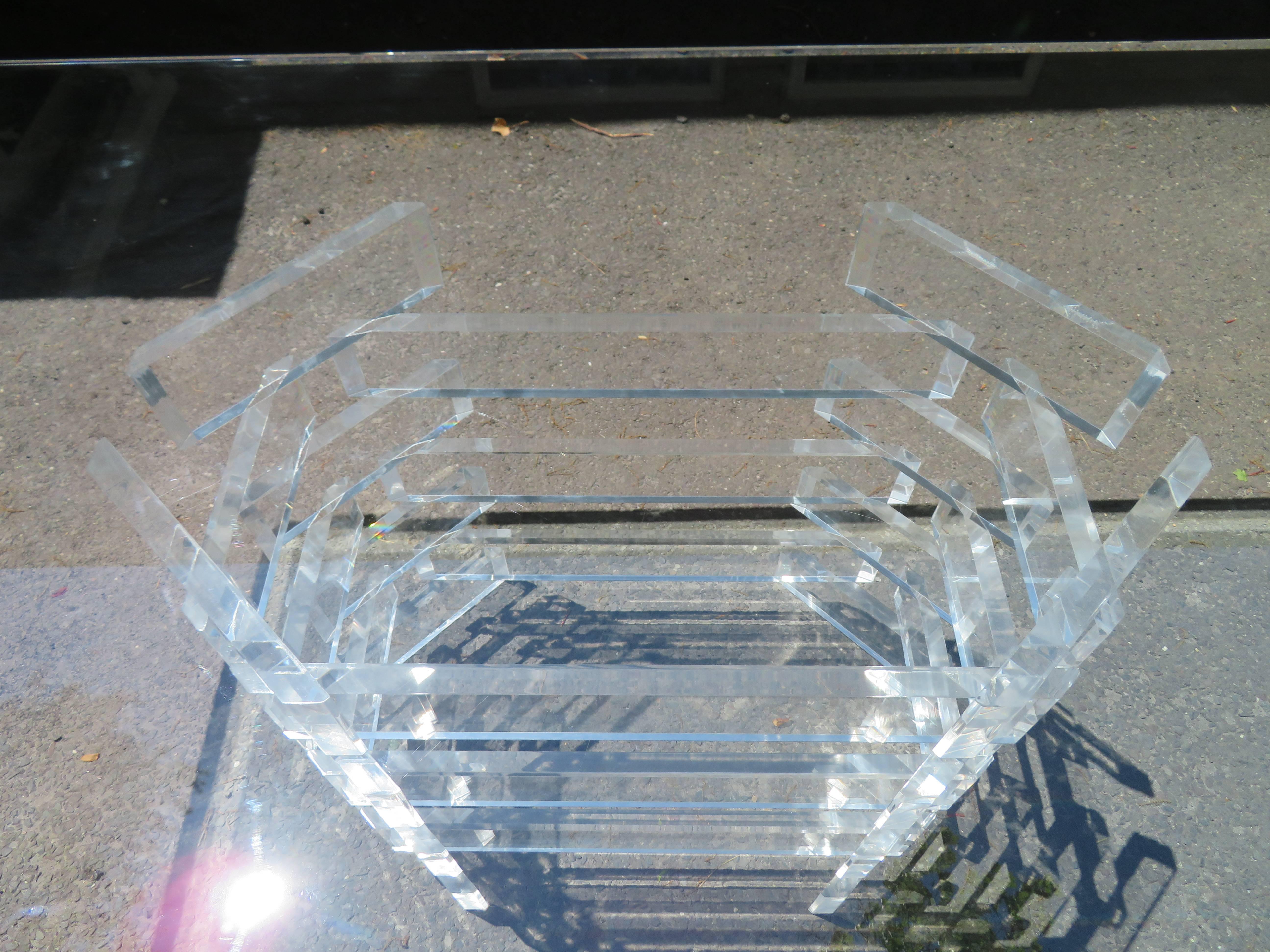 Stunning stacked Lucite dining table or desk. The many cuts and facets on the edges make the base sparkle and shine! The Lucite is in excellent condition! This piece is gorgeous in person and would look great in your dining room or office.