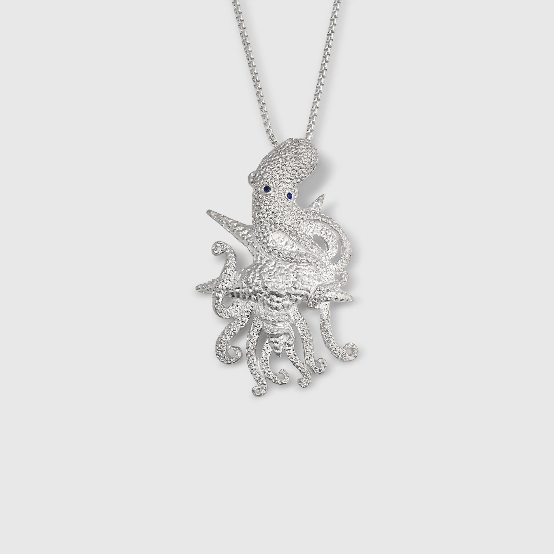 Large, Stunning Sterling Silver Detailed Octopus Pendant Necklace w/ Round, Bright Blue Sapphire Eyes by Ashley Childs

This stunning detailed octopus was originally carved by 
