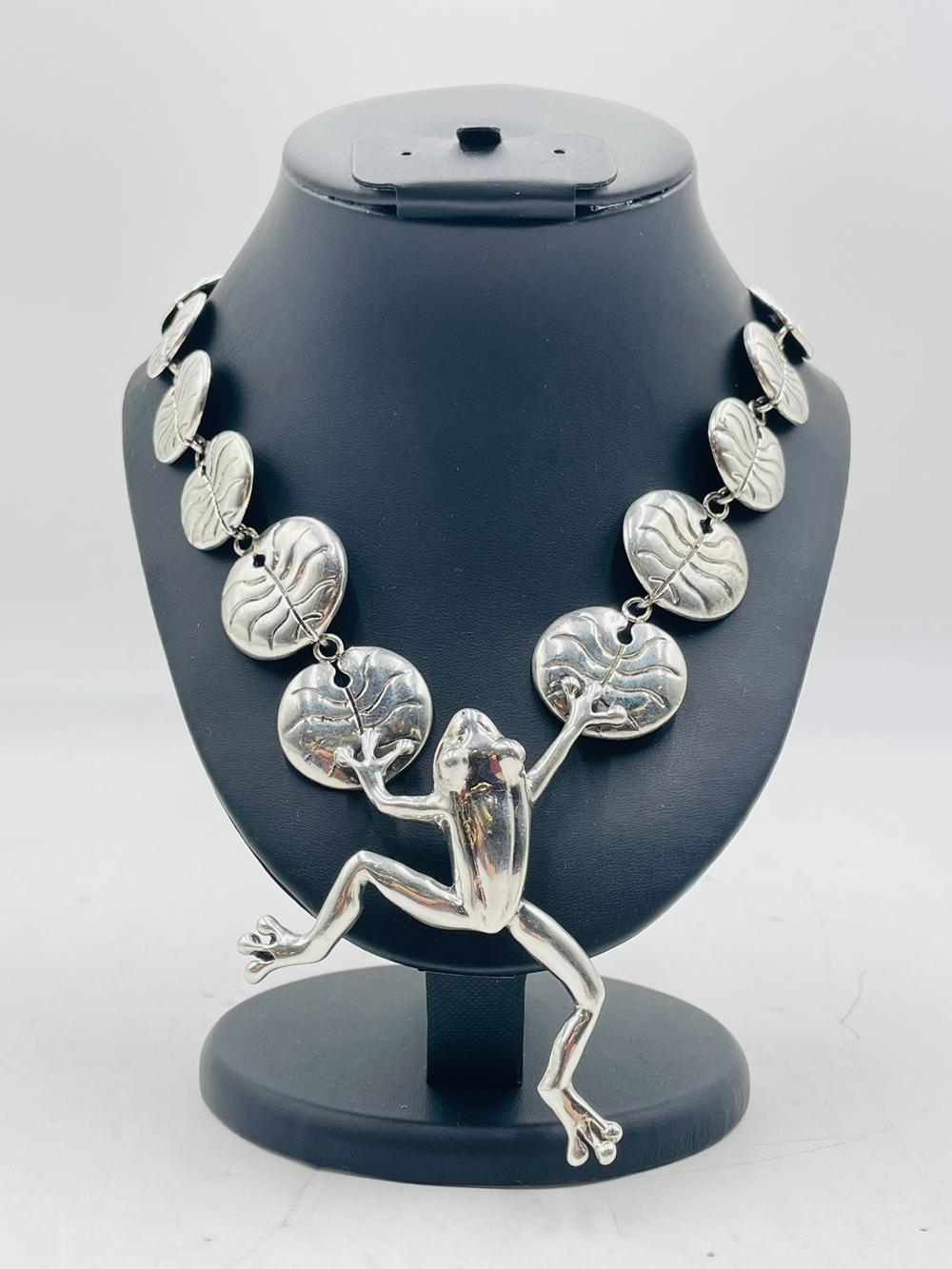 Stunning necklace designed and manufactured in Taxco, Mexico by Emilia Castillo. 

The piece is made in .950 sterling silver, the piece is inspired in the story of Alicia en el Pais de las Maravillas (Alice in Wonderland) hence the monkey climbing