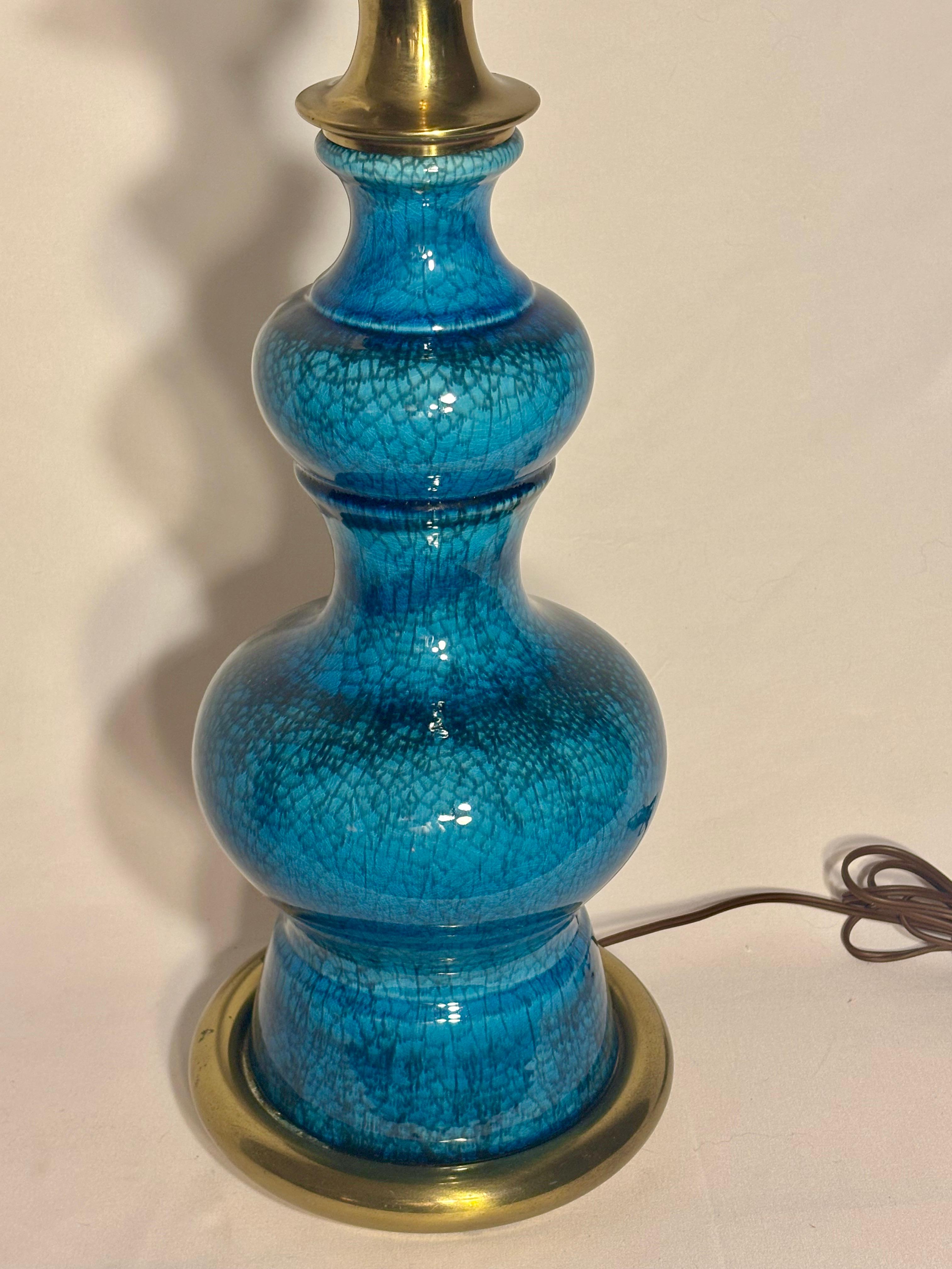 Striking Blue Pagoda lamp by Stiffel is a beautiful example of mid-century design with Eastern architectural inspiration.  

Rooted in legacy of craftsmanship, Stiffel's lamp reflects global influence into domestic interiors.  

This stunning lamp