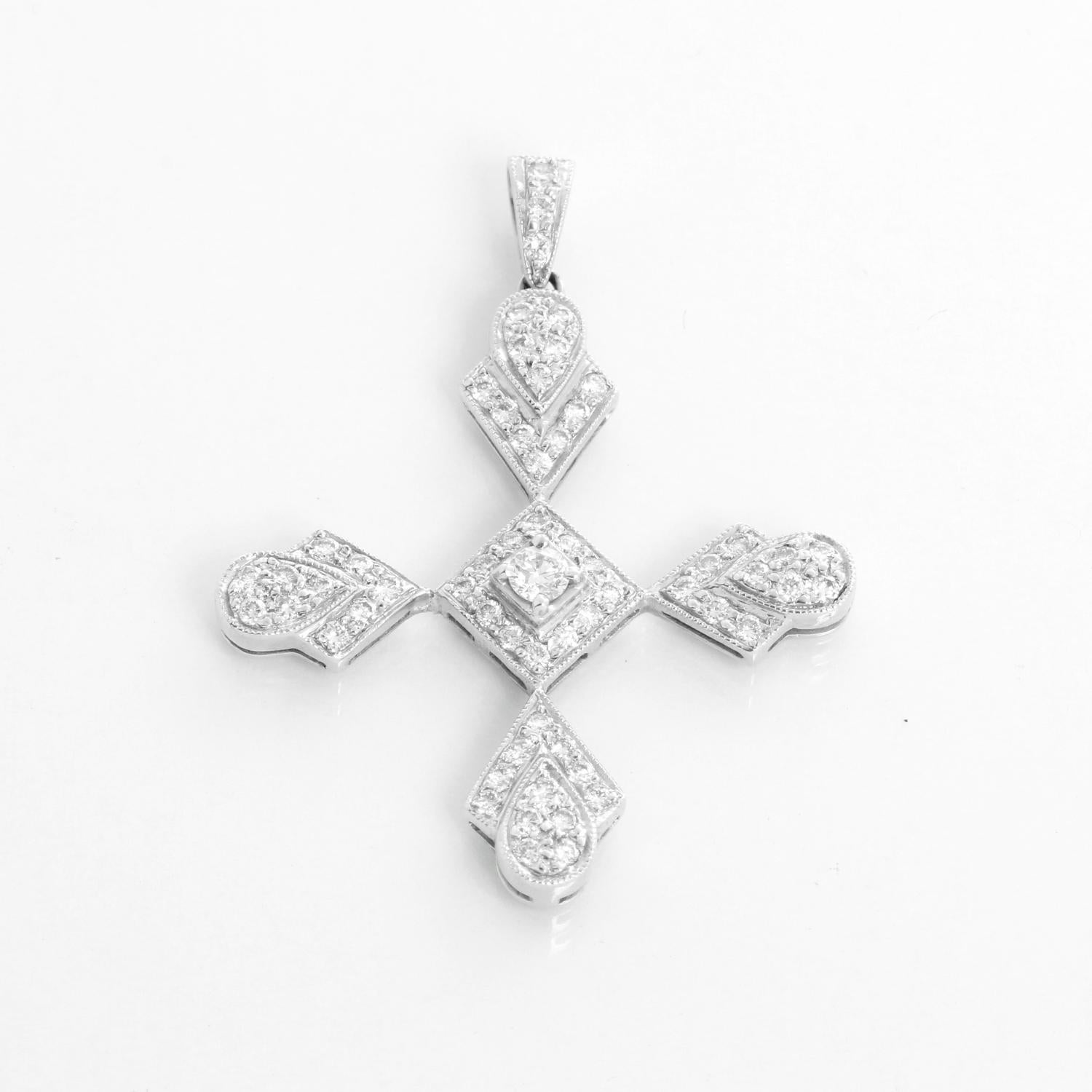 Stunning Sue Gragg 18k White Gold Diamond Cross with Necklace - Measures 1.25 inches in length and width. Chain length 16 inches.  Approx. 1 ct weight 

Sue Gragg is a jewelry designer based in Dallas, Texas, known for her unique and high-end