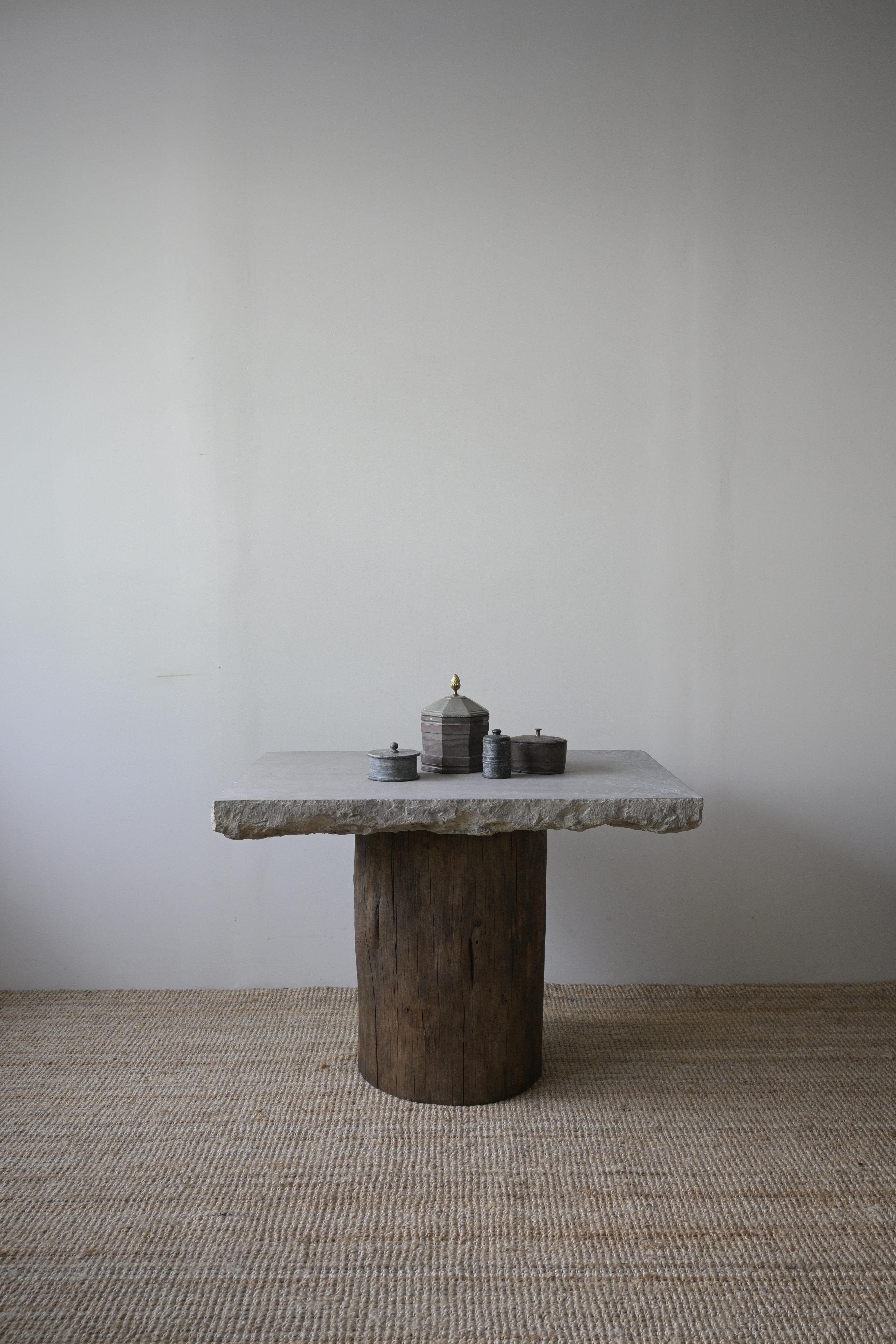 Stunning Swedish Stone Table 18th/19th century

The stone slab has been used as a grinding stone, once by traditional painters.
And the original grinding stone is truly remarkable.

Made of Swedish limestone, with a stunning thickness and a