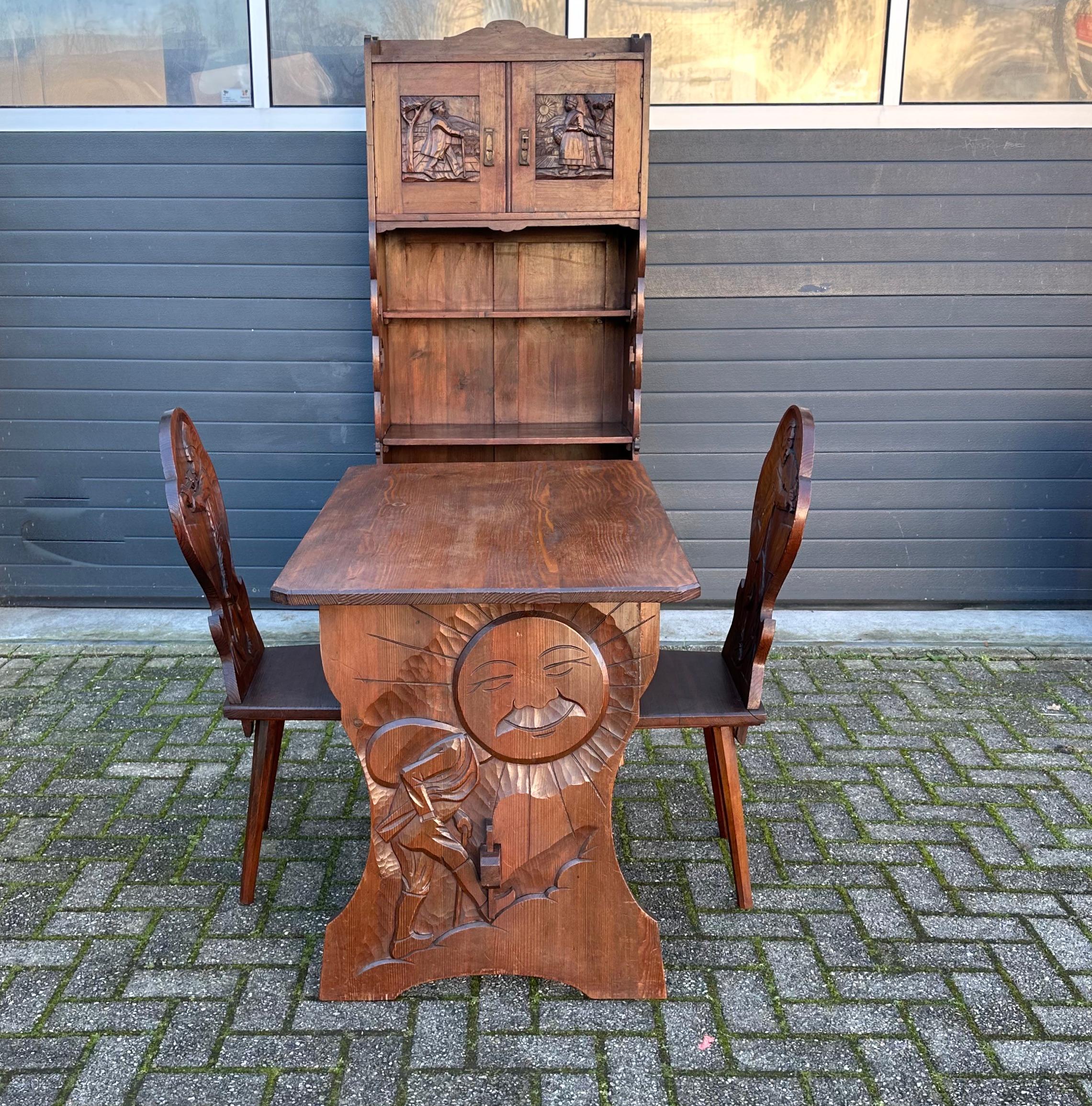 Rare folk art set with great carvings on cottage cupboard, table and matching chairs.

If you are looking for a unique set for your chalet, home, cottage or kitchen then this very rare and Swiss made cupboard, chairs and table could be perfect for