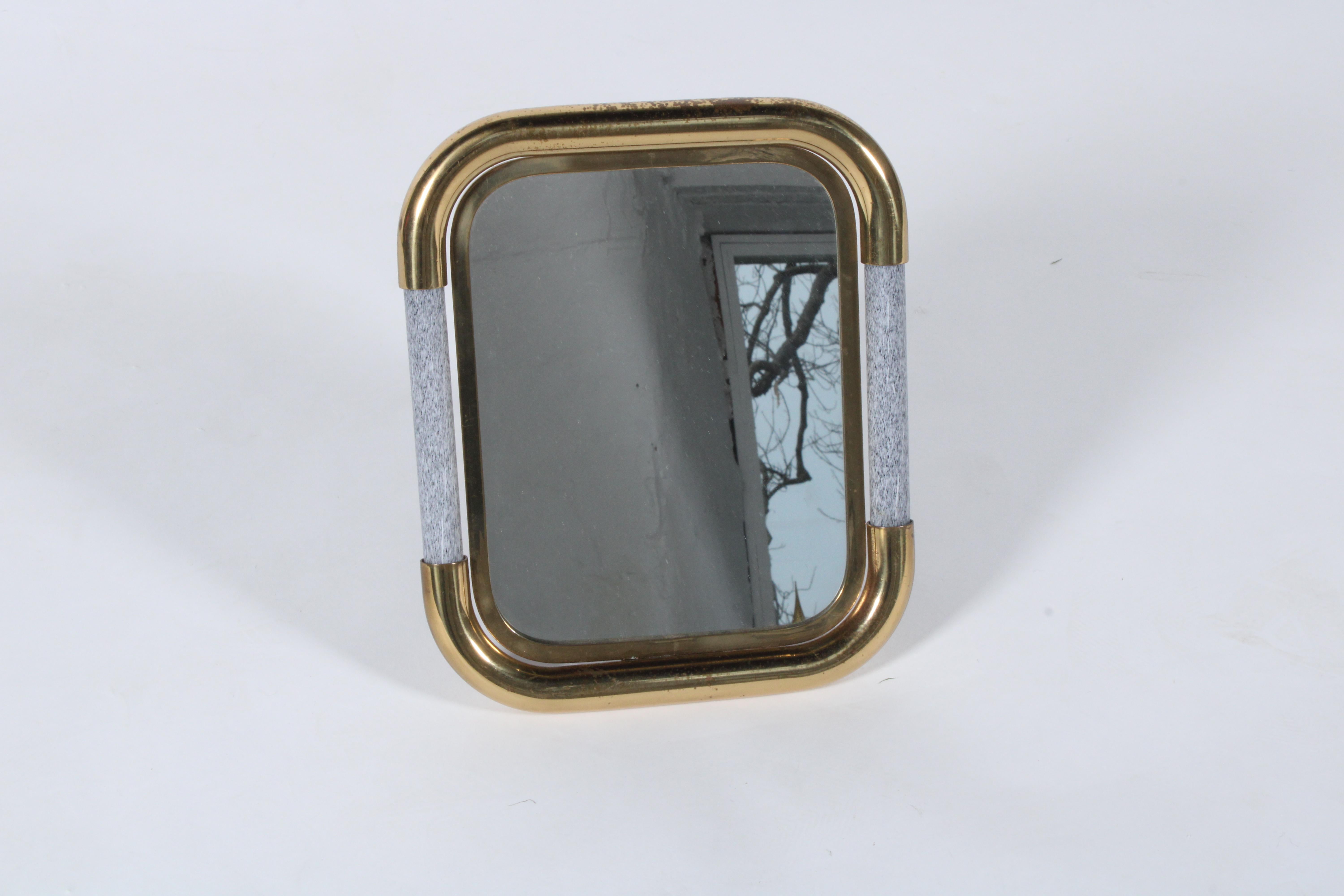 Stunning vintage original Tommaso Barbi table top mirror in brass and Murano glass that is white with speckled black colouring  and has an easel stand to allow for free standing. This versatile piece is stamped to the rear and is very good vintage