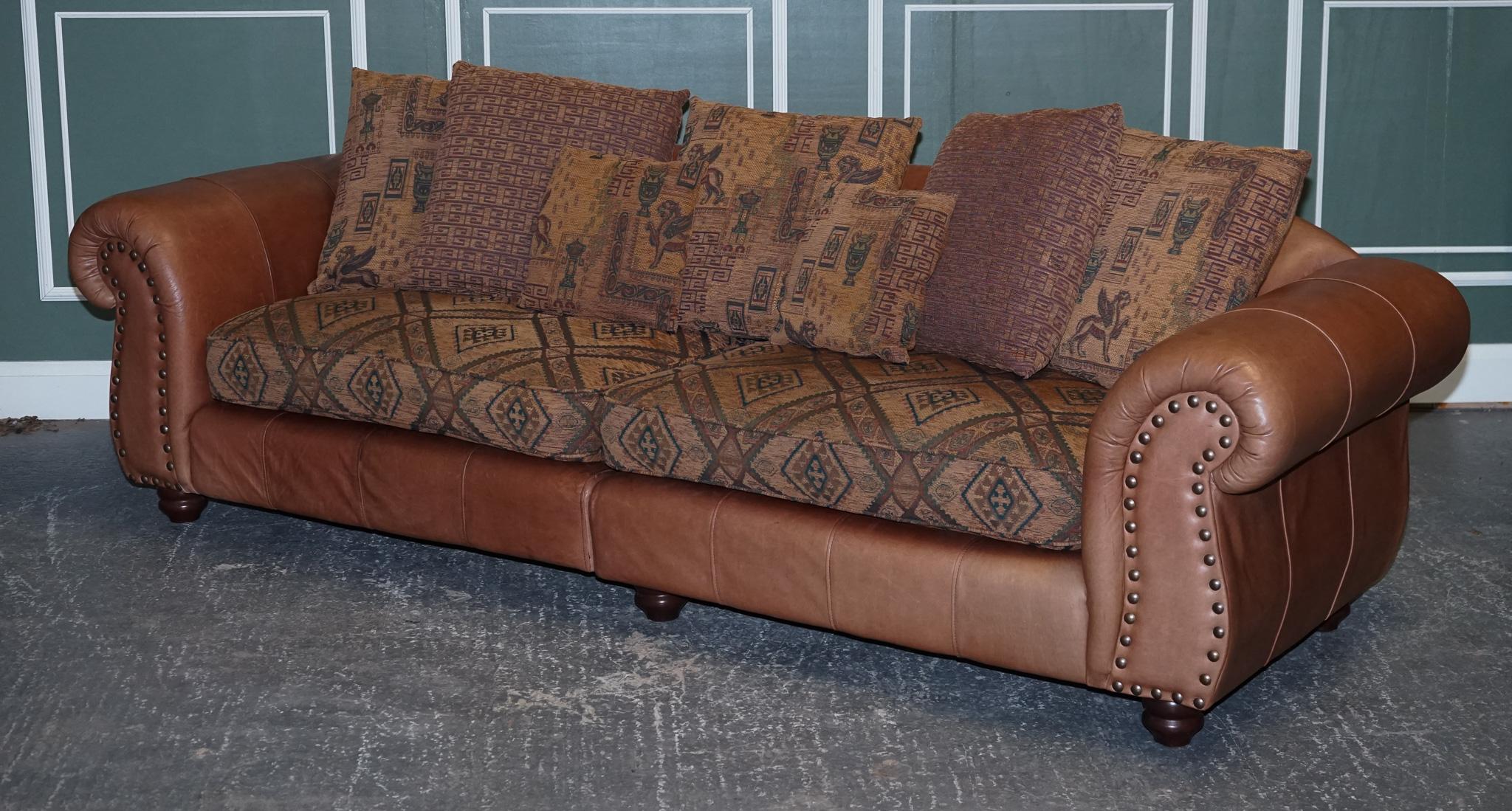 We are delighted to present this sStunning Thomas Lloyd lather with Egyptian Pattern Fabric grand sofa.

We have deep cleaned the sofa throughout, hand waxed and hand polished the leather.

Condition-wise, there will be some patina and cosmetic
