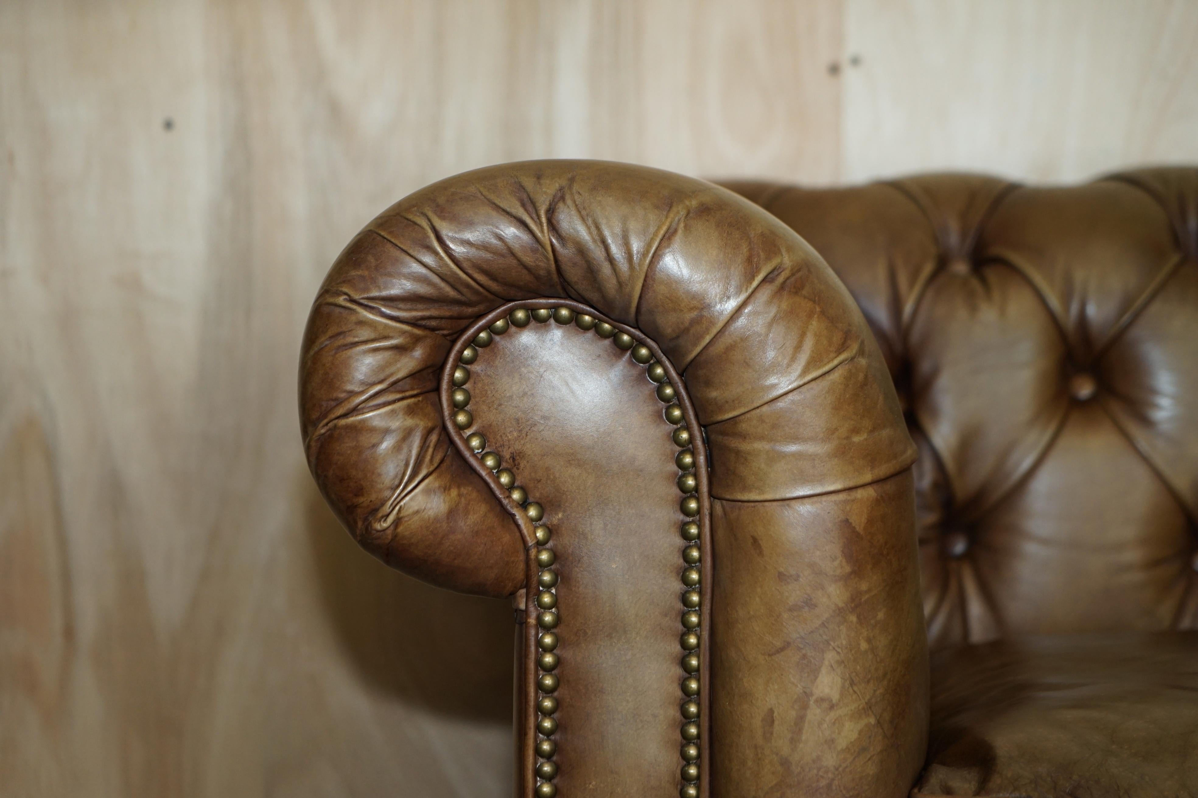 tufted brown leather sofa