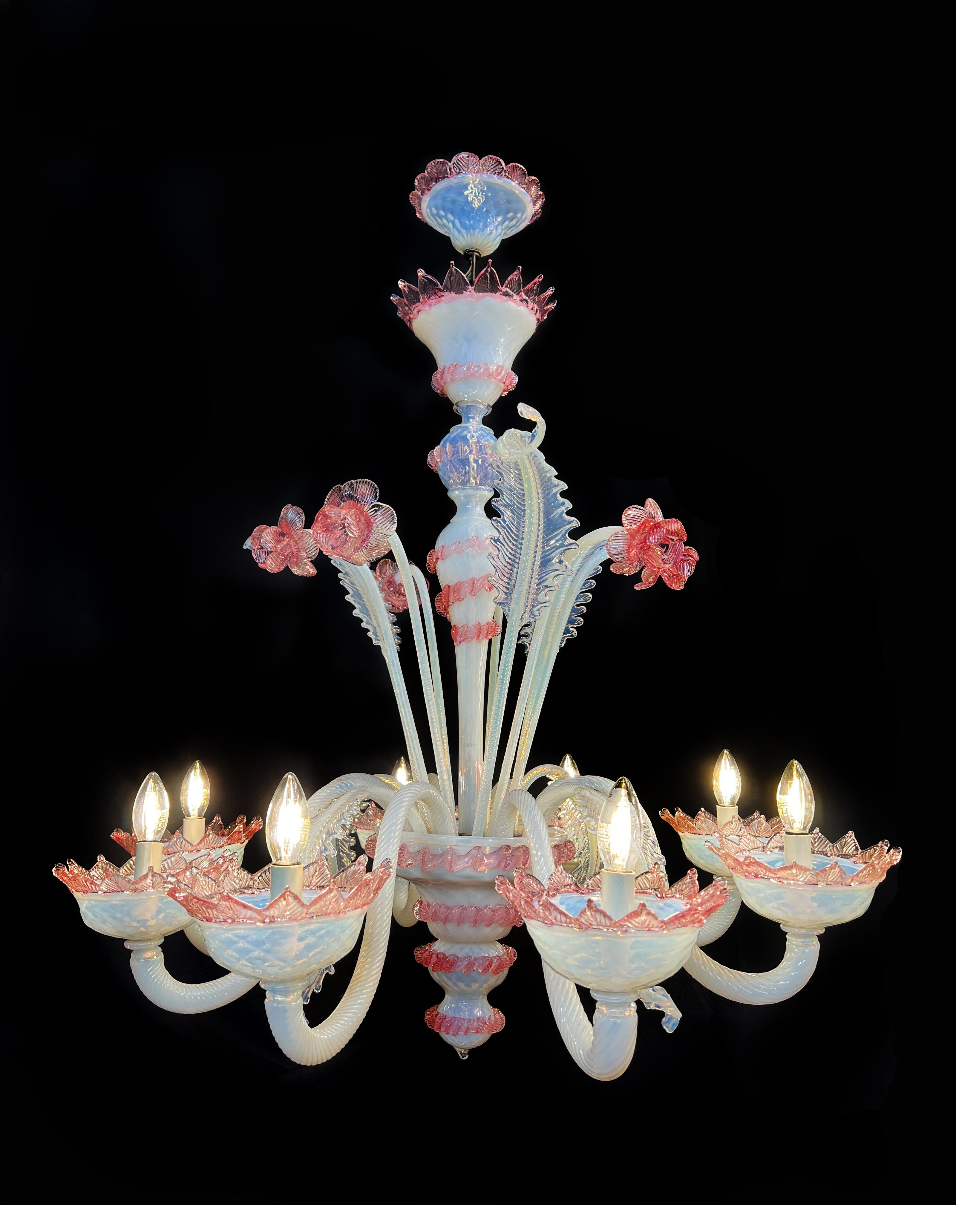 Trio Murano chandelier of awesome beauty. 
1) Lights (8) flowers and leaves in pure Murano glass paste. 
Dimensions: Height: 47.25 in (120 cm)Diameter: 27.56 in (70 cm)
2) Lights (8) flowers and leaves in pure Murano glass. 
Dimensions: Height: