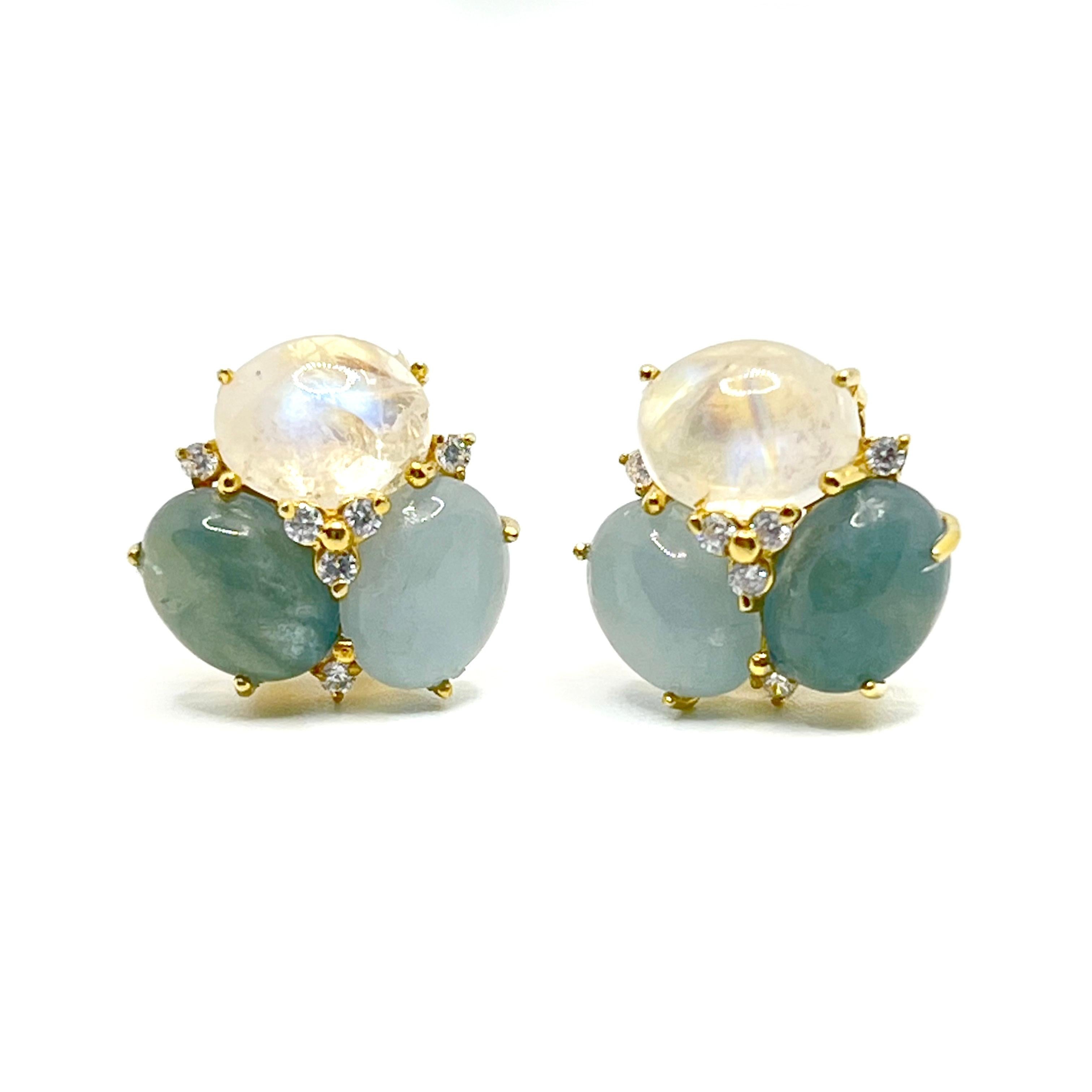 These stunning pair of earrings feature sets of oval cabochon-cut aquamarine, green beryl, and rainbow moonstone, adorned with round simulated diamonds, handset in 18k yellow gold vermeil over sterling silver. The combination of these three color