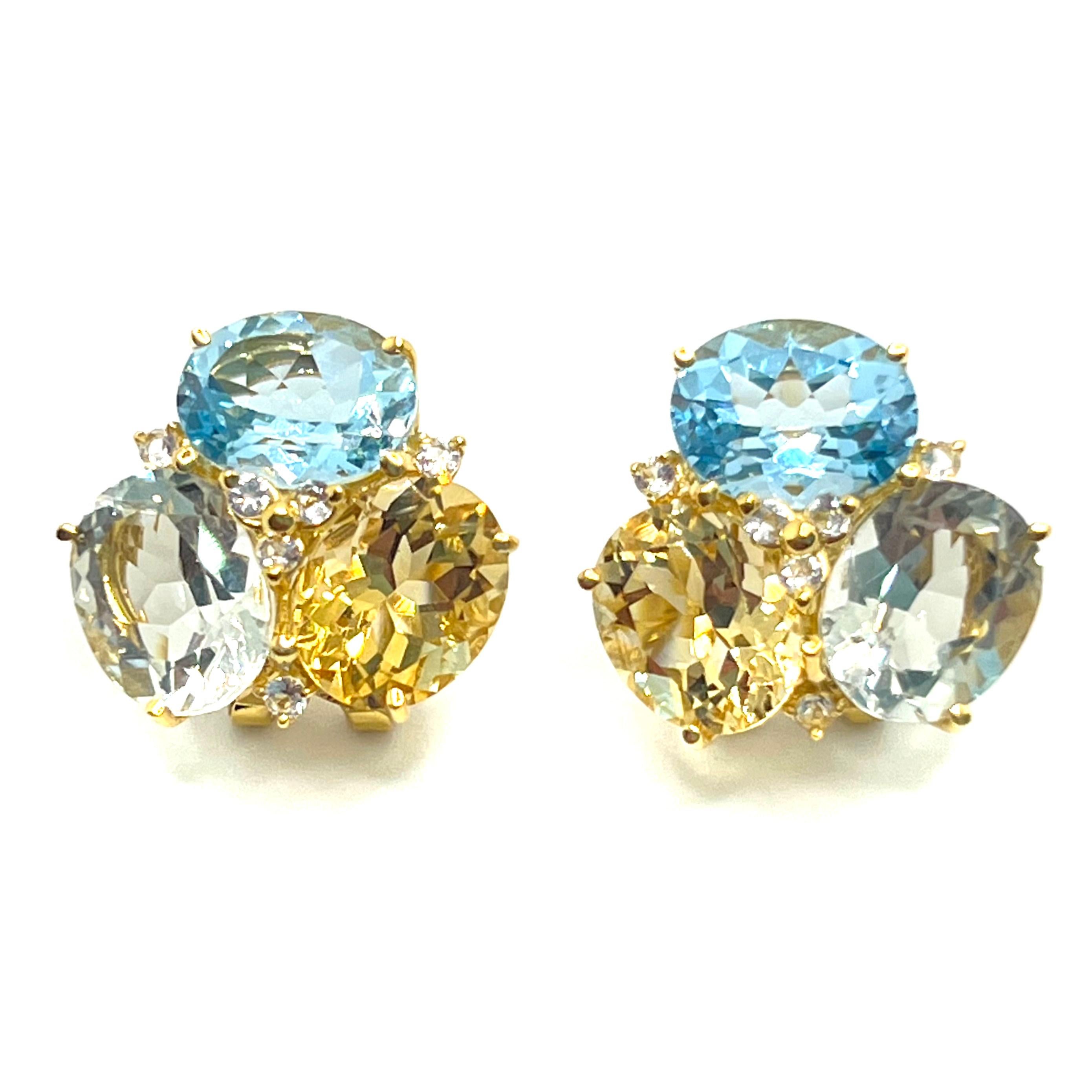 These stunning pair of earrings feature sets of oval genuine blue topaz, citrine, prasiolite adorned with round white topaz, handset in 18k yellow gold vermeil over sterling silver. The vibrant color combination of three stones produce beautiful