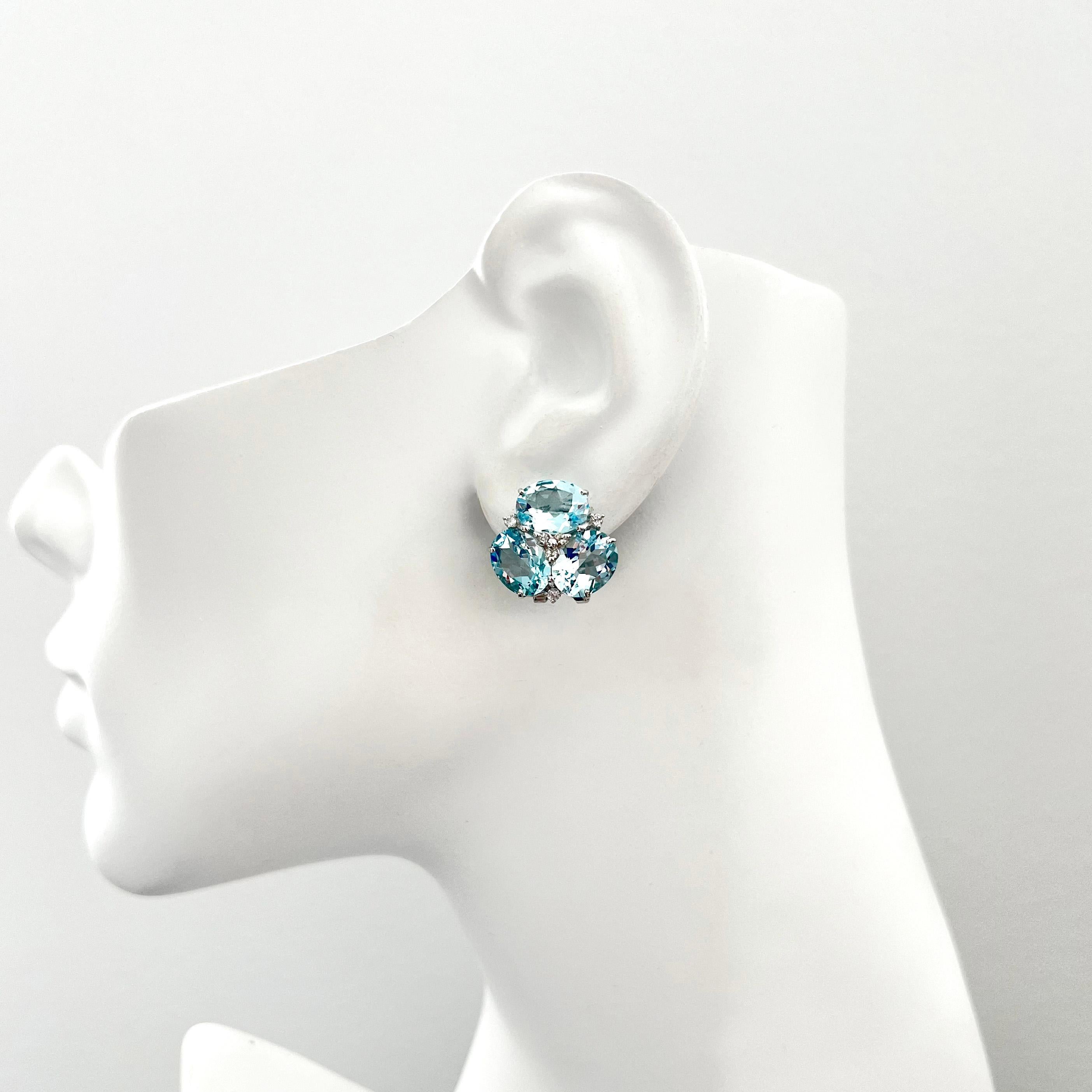 Superbes boucles d'oreilles Topaze bleue triple ovale Unisexe en vente