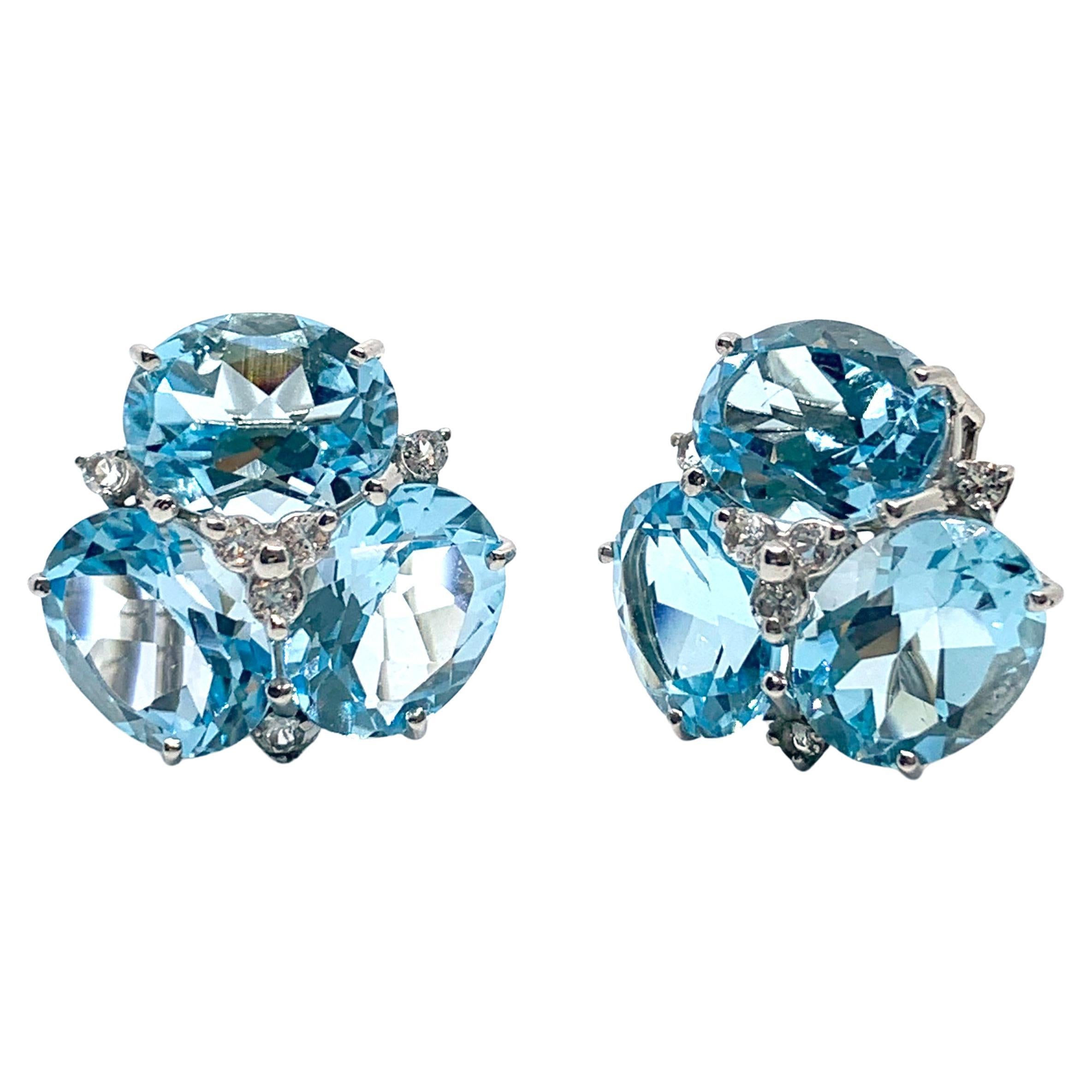 Superbes boucles d'oreilles Topaze bleue triple ovale