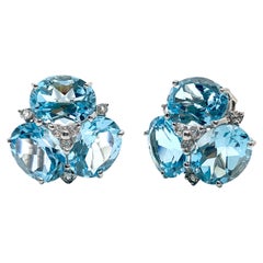 Superbes boucles d'oreilles Topaze bleue triple ovale