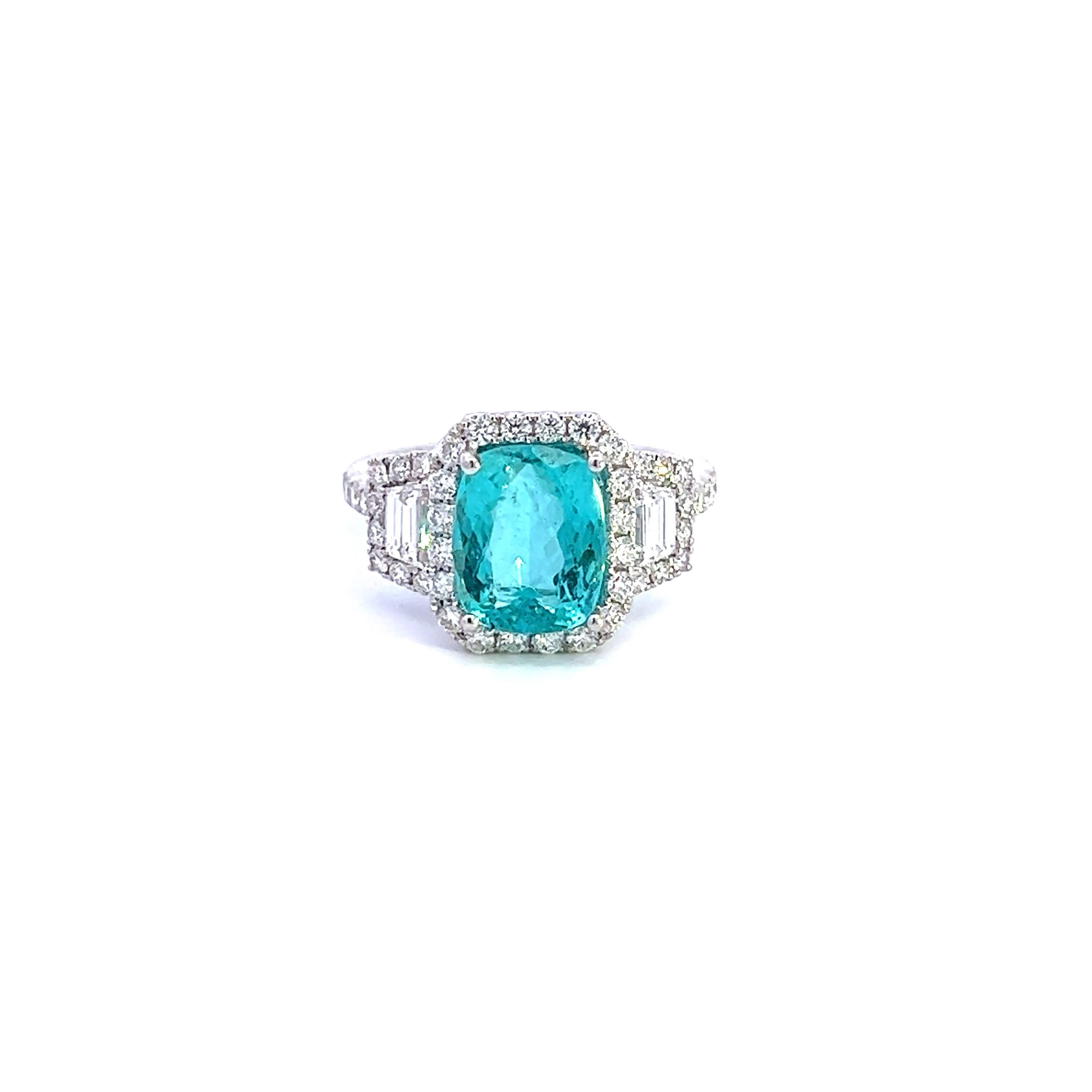 This exquisite ring features a captivating turquoise center stone, surrounded by sparkling diamonds that enhance its brilliance. The elegant design combines modern sophistication with timeless charm, making it a perfect accessory for any occasion.