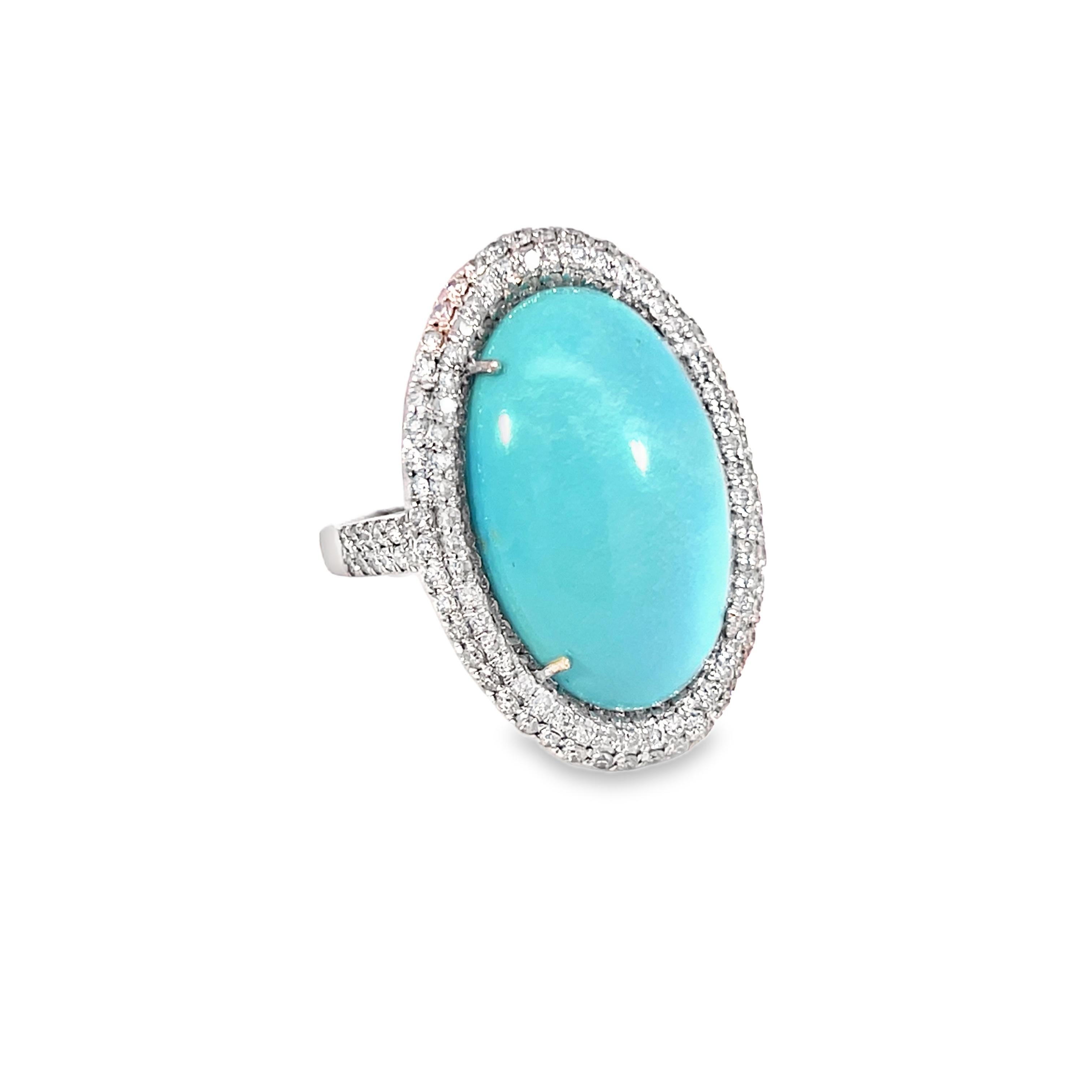 Experience the breathtaking beauty of this sophisticated turquoise ring set with dazzling 1.19-carat diamonds. The elaborate 14-Kt white gold setting nicely complements the beautiful 12.04-Carat oval-shaped turquoise, making it a unique item for any
