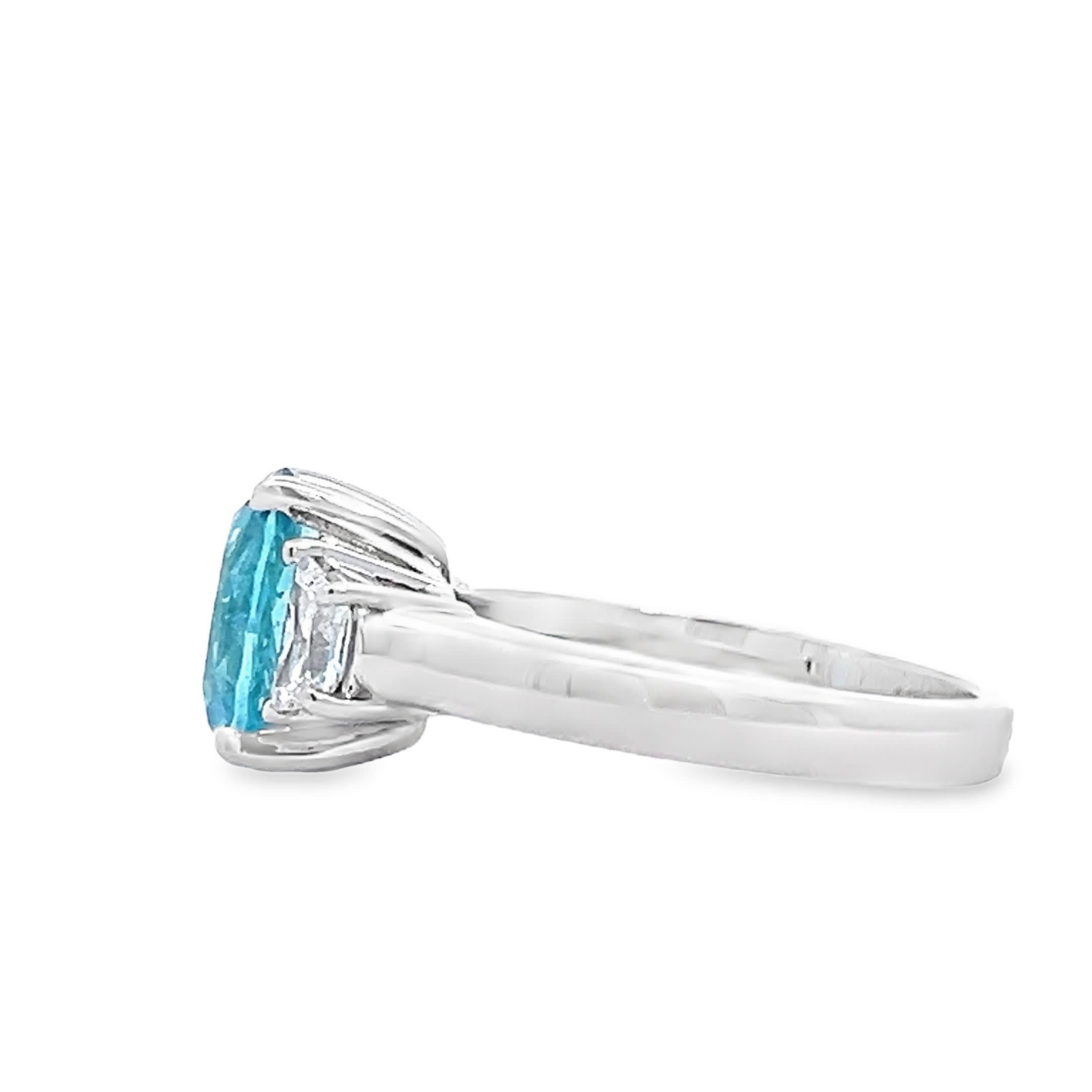 This exquisite turquoise gemstone ring features a vibrant oval stone, surrounded by sparkling diamonds. Crafted with precision, it embodies elegance and sophistication, making it the perfect accessory for any occasion. Elevate your jewelry