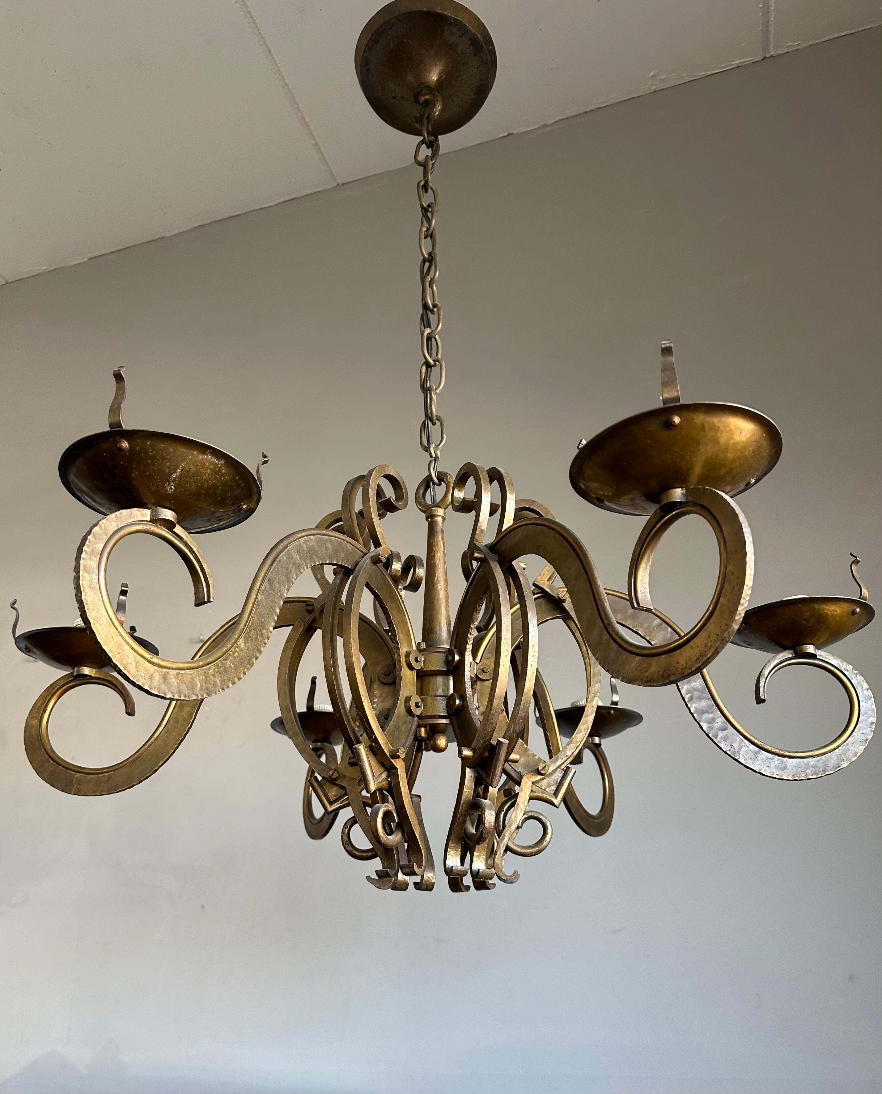 Rare and amazing workmanship, brass and bronze Arts and Crafts pendant.

If you live or work in an Arts & Crafts building and you are looking for the perfect fixture to grace your living or work space then this unique and all handcrafted, six-light