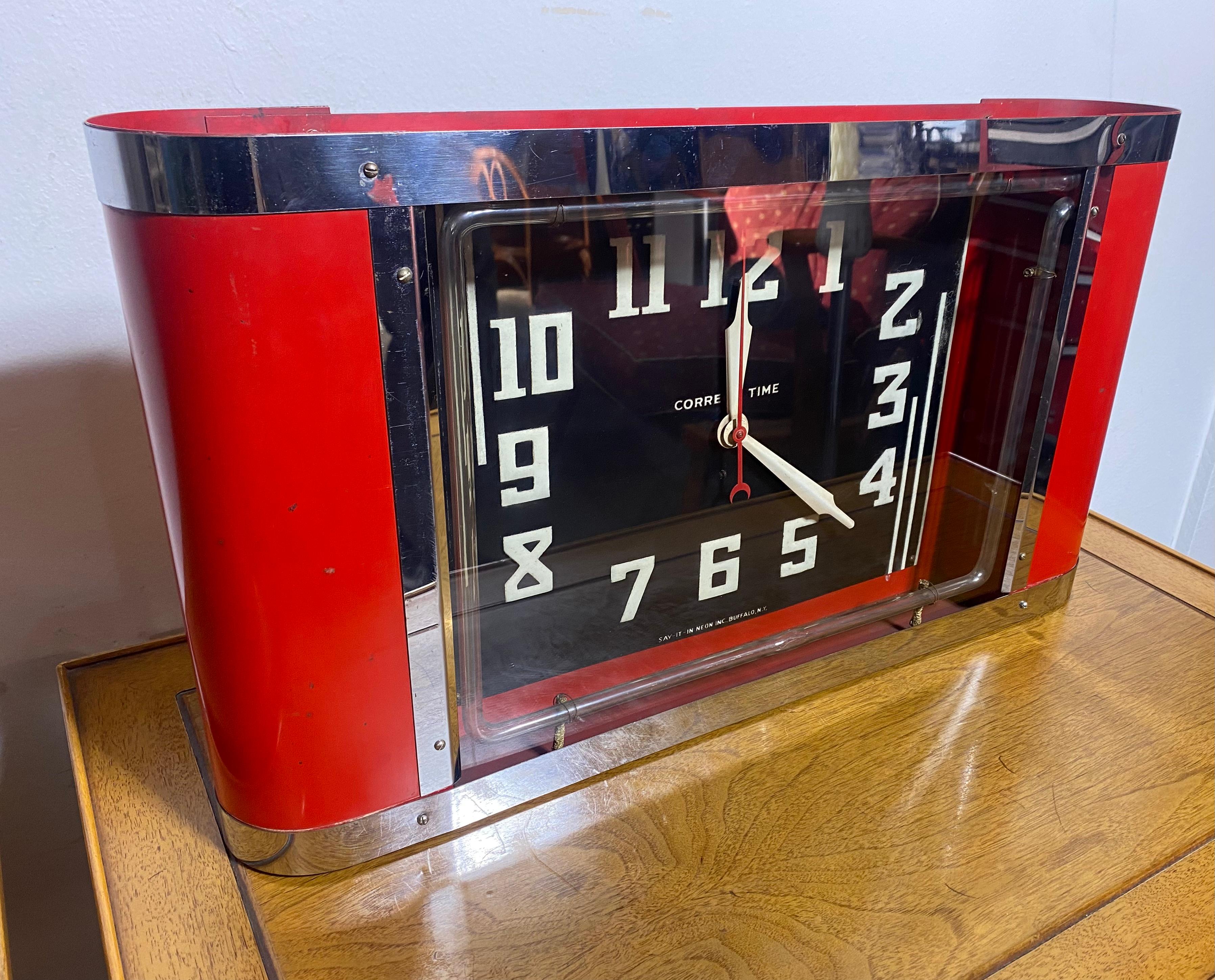 Probably the cleanest Art Deco NEON CLOCK I have ever owned, manufactured by (say it in neon inc.) Buffalo New York .. Stunning red can,, chrome speed lines,, Retains original red neon,, original clock face and original transformer as well as