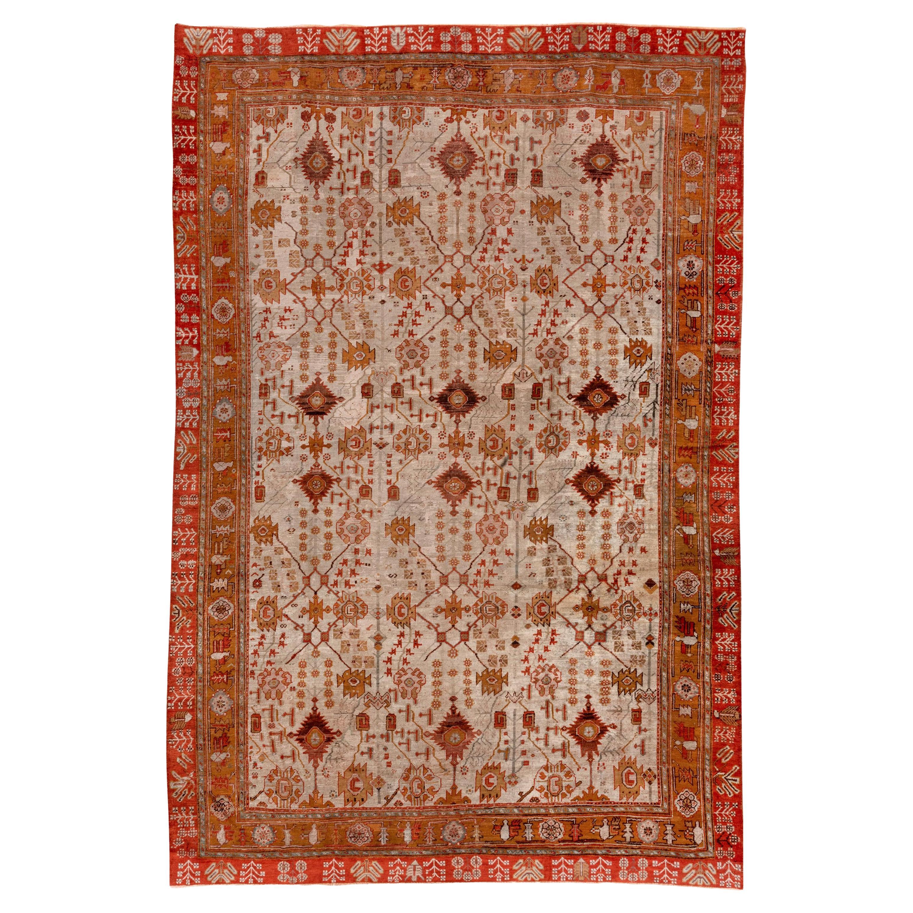 Stunning and Unusual Antique Oushak Rug, Double Colorful Border, Zanbaki Design For Sale