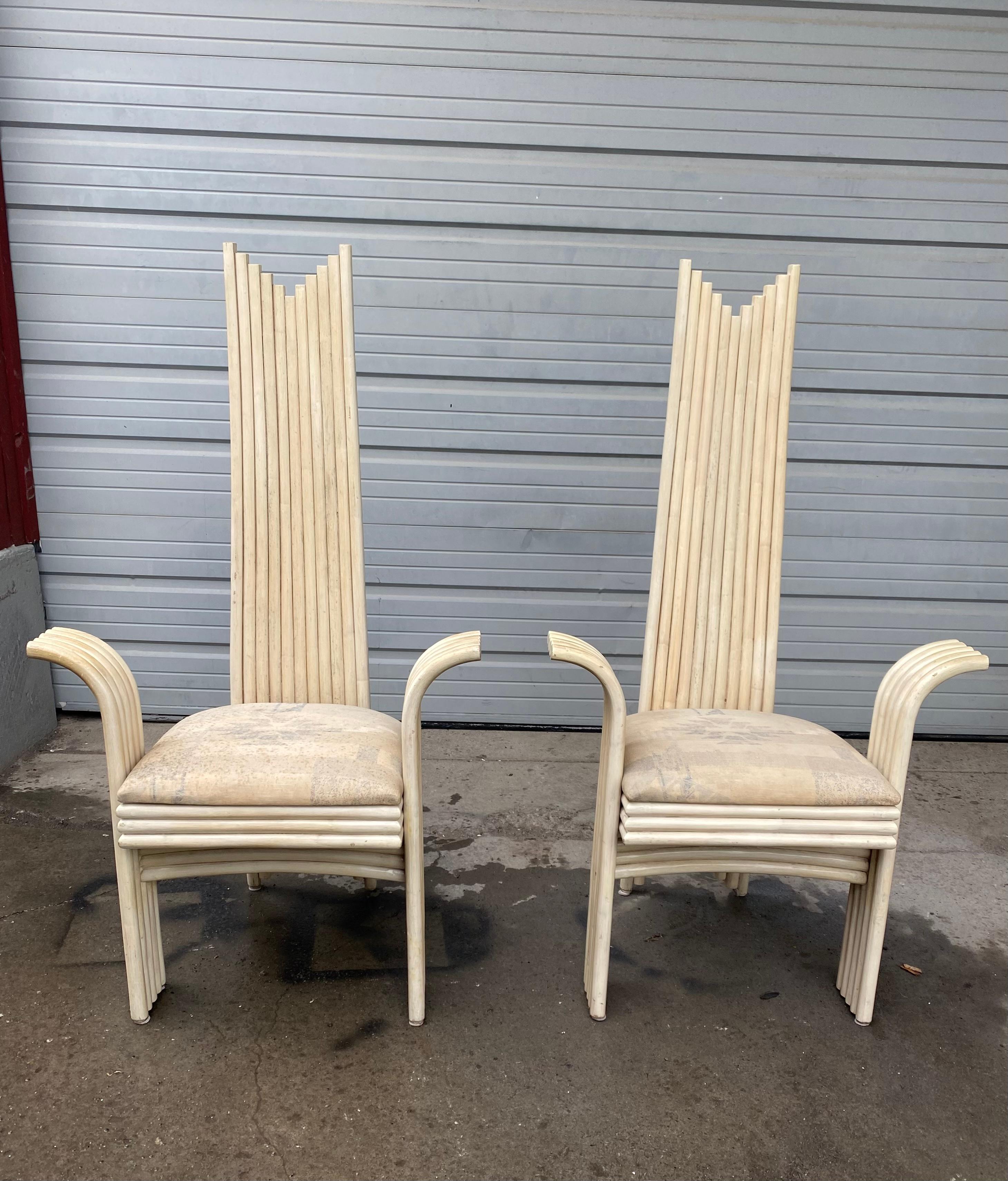 Matching Pair Curved High Back Stylized Rattan Arm Chairs,
Attributed to Danny Ho Fong (Designer)
Made by Mcguire,, seats in need of restoration.. Hand Delivery avail to New York City or anywhere en route from Buffalo NY.