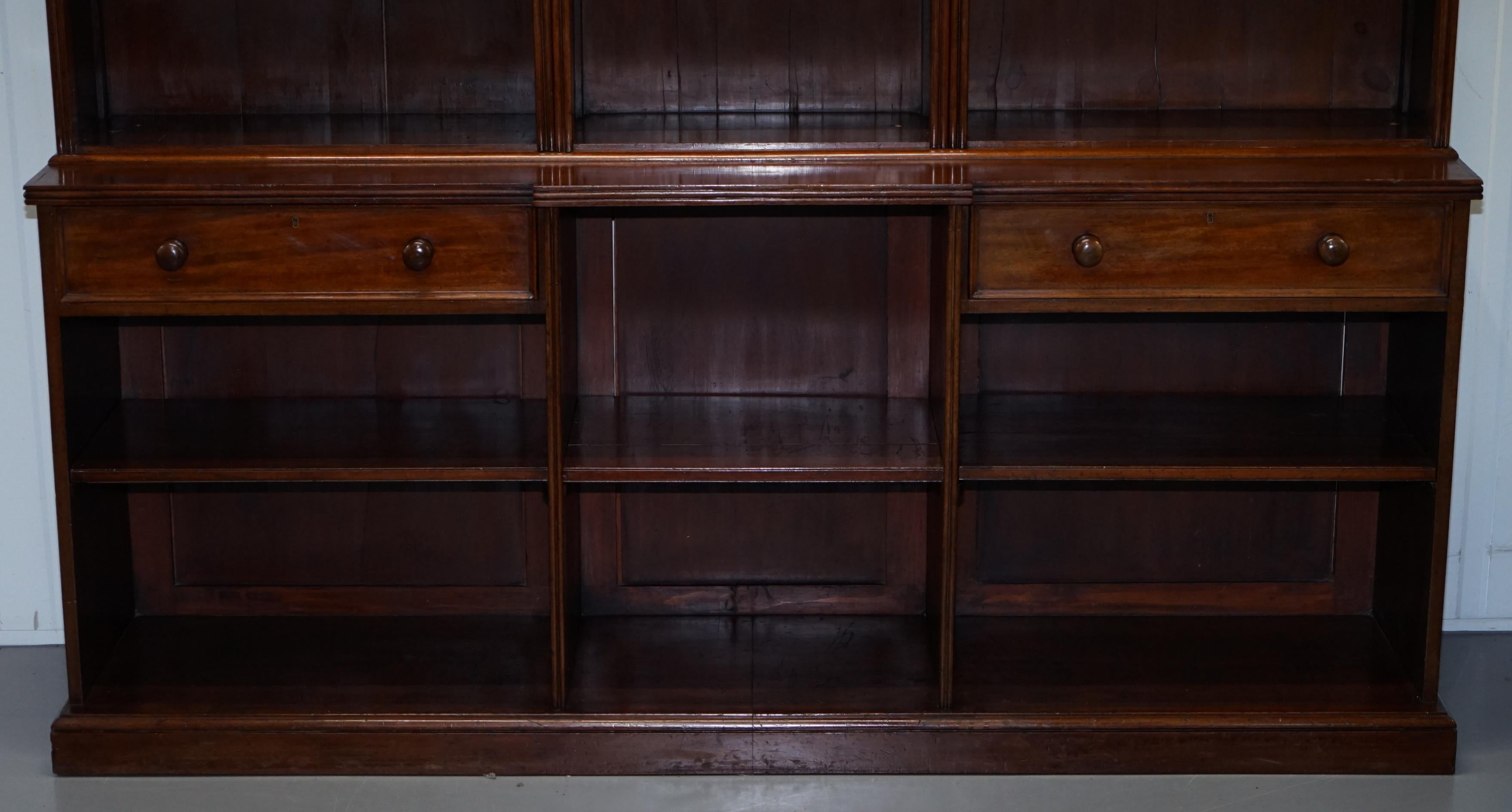 We are delighted to offer for sale this stunning and very large Victorian circa 1860 solid mahogany library breakfront bookcase

A truly stunning piece, this bookcase is very tall, all the shelves are removable and height adjustable so you can