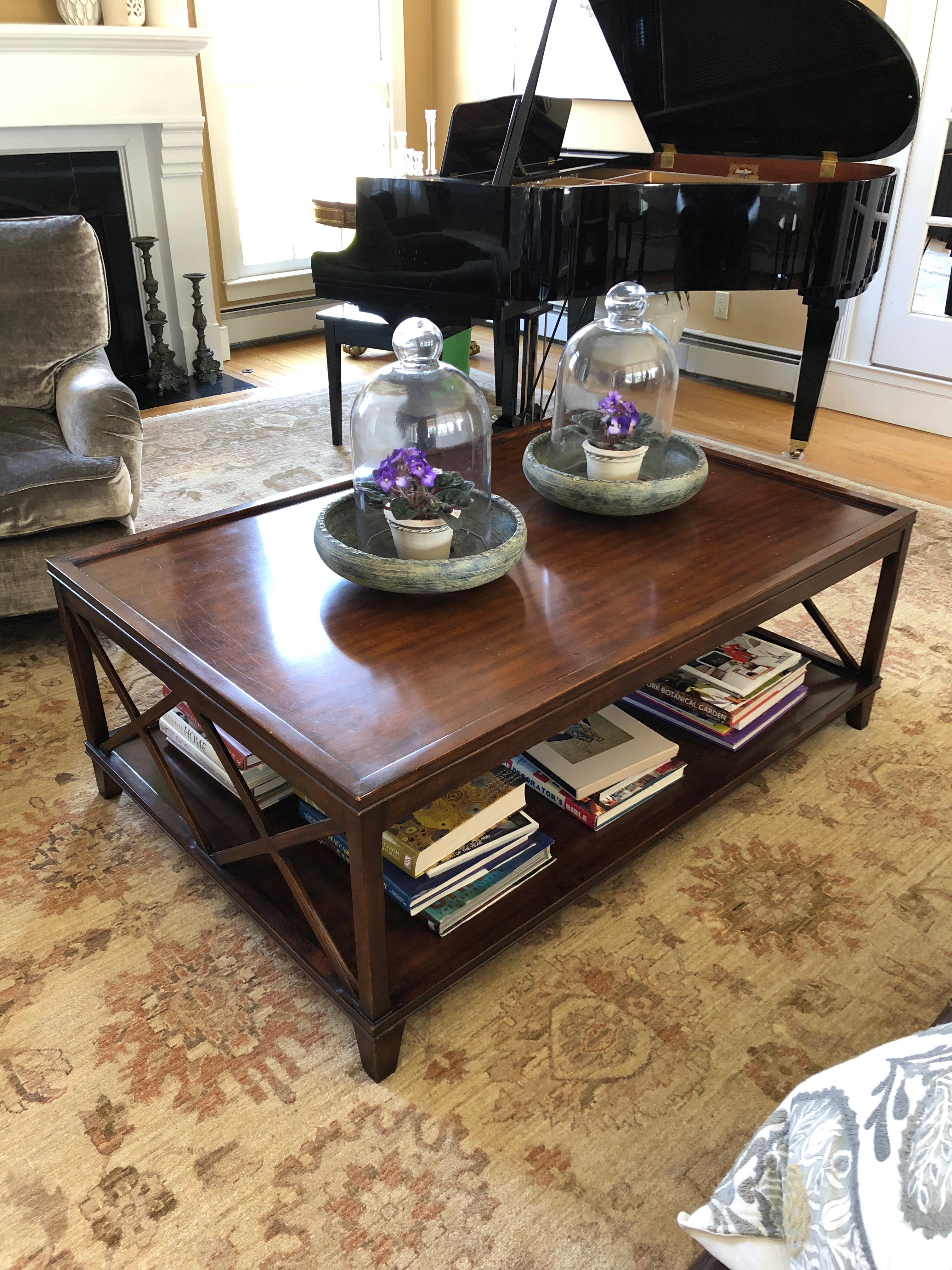 A very large two-tier walnut X base coffee table with great style and room for lots of books and magazines. By Old Town Crossing.
