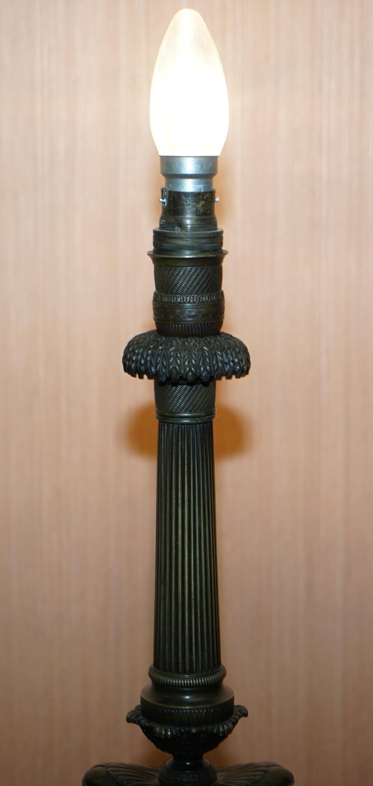 We are delighted to offer for sale this lovely original circa 1860-1880 solid bronze candlestick lamp conversion of a Corinthian pillar with Lion paw feet

This lamp has been in my private collection for years, it has a polished black marble base,