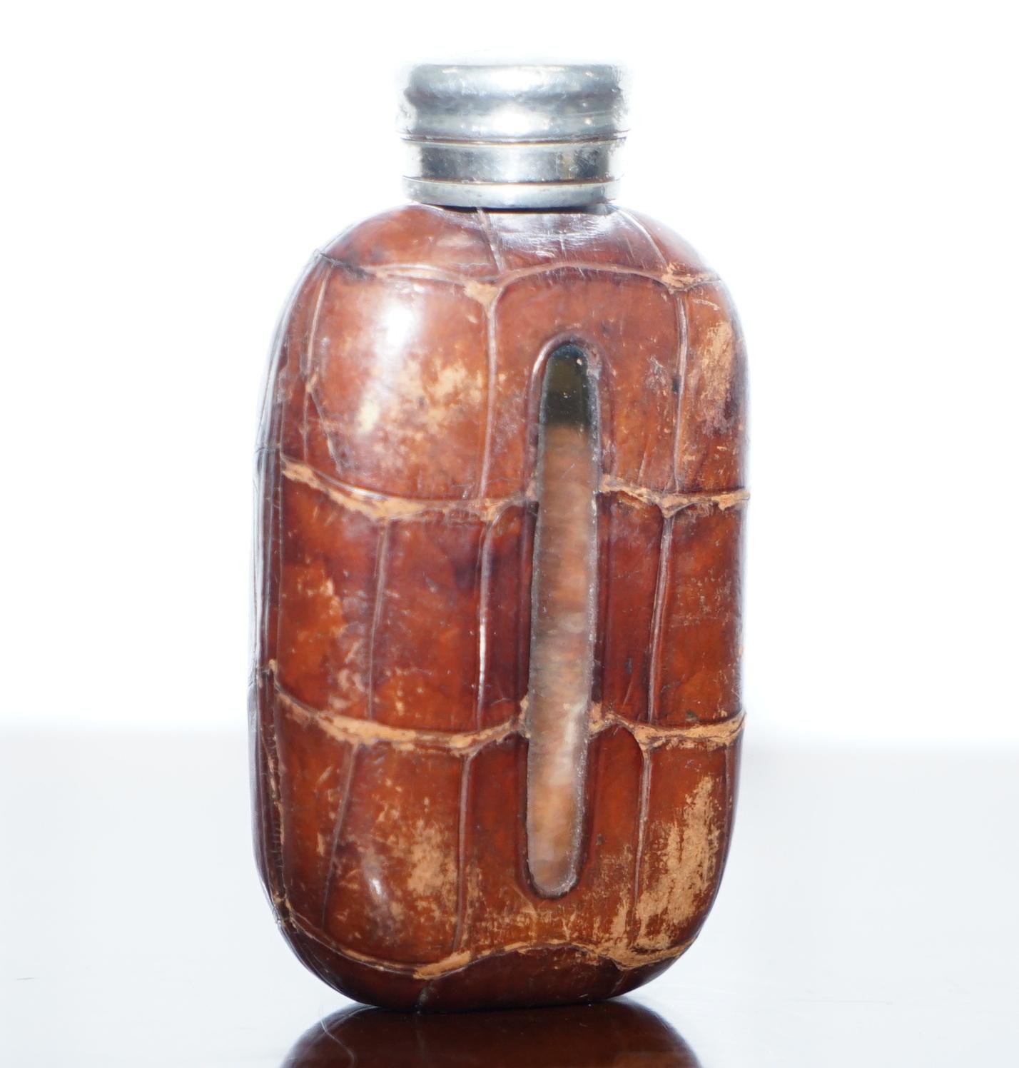 We are delighted to offer for sale this attractive small Alligator leather Victorian hip flask engraved Made In England

A stunning little find, very elegant and super rare to find with the Alligator leather, the middle section is cut-out on both