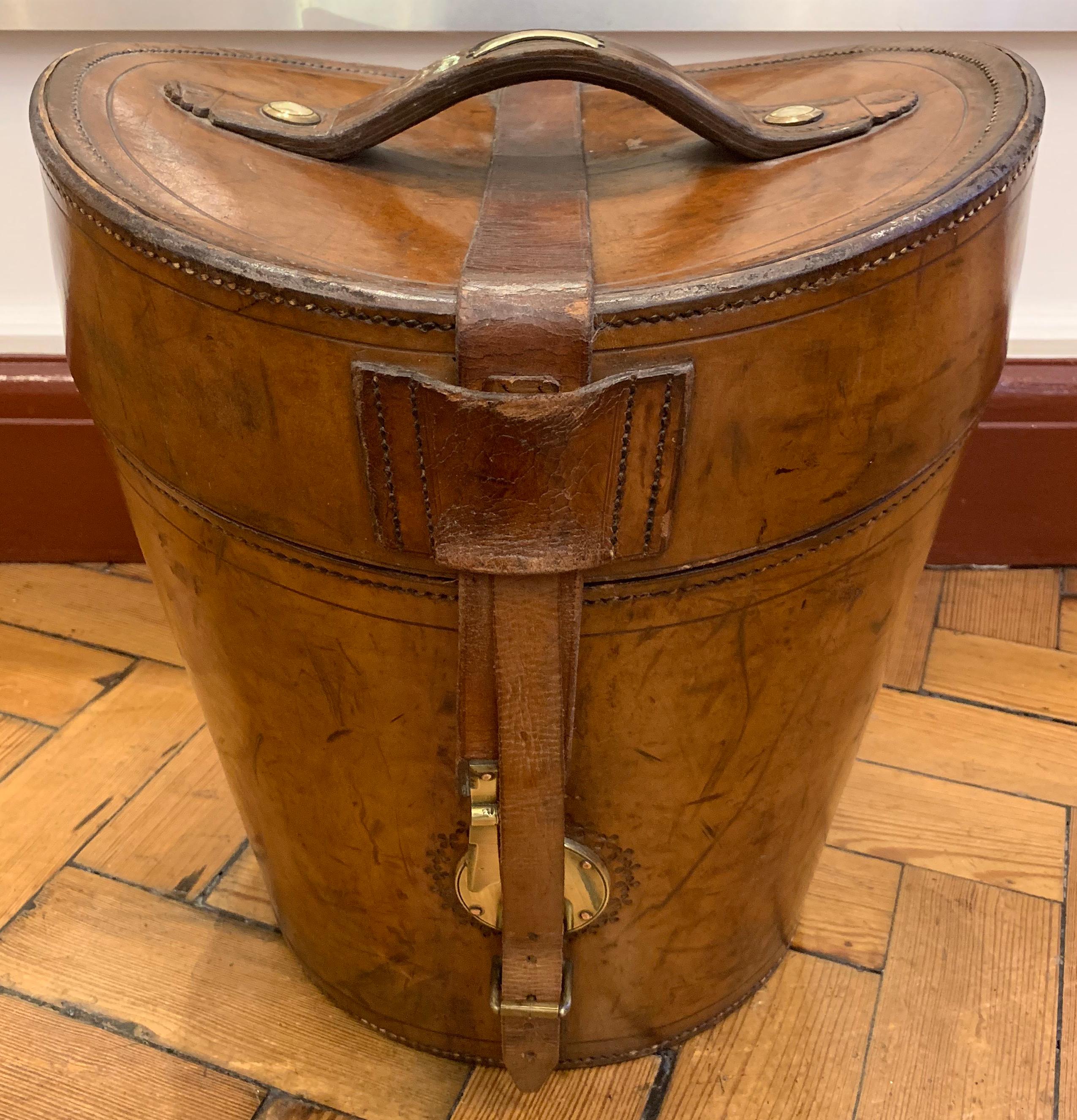A stunning and exceptional all leather gentleman's triple hat box. With space inside for two regular top hats placed upside down, the space inside the lid for a collapsible top hat. In superb condition throughout, circa 1890

The interior having a