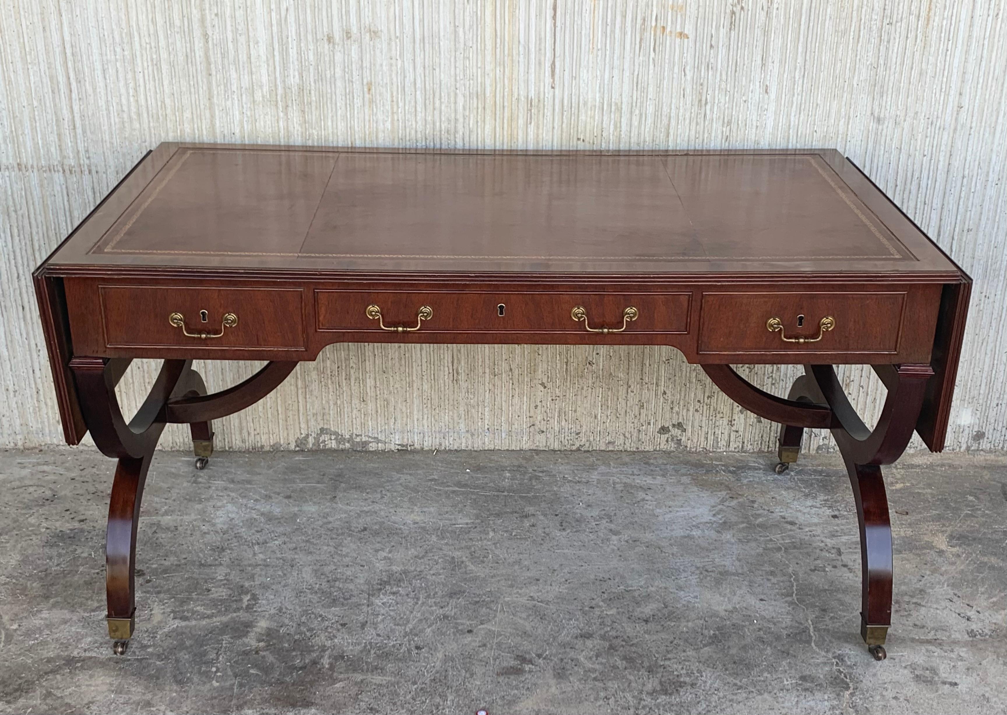 We are delighted to offer for sale this stunning Victorian library table writing desk with brown leather gold leaf tooled writing surface and Gillows style reeded legs A very fine piece of Victorian Library furniture. Its quite slim which makes it
