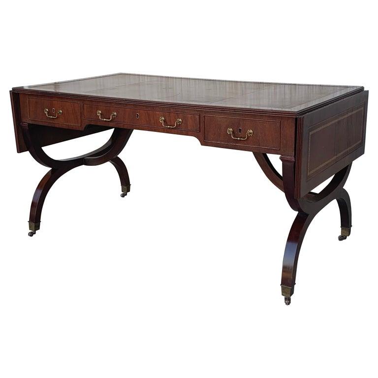We are delighted to offer for sale this stunning Victorian library table writing desk with brown leather gold leaf tooled writing surface and Gillows style reeded legs A very fine piece of Victorian Library furniture. Its quite slim which makes it