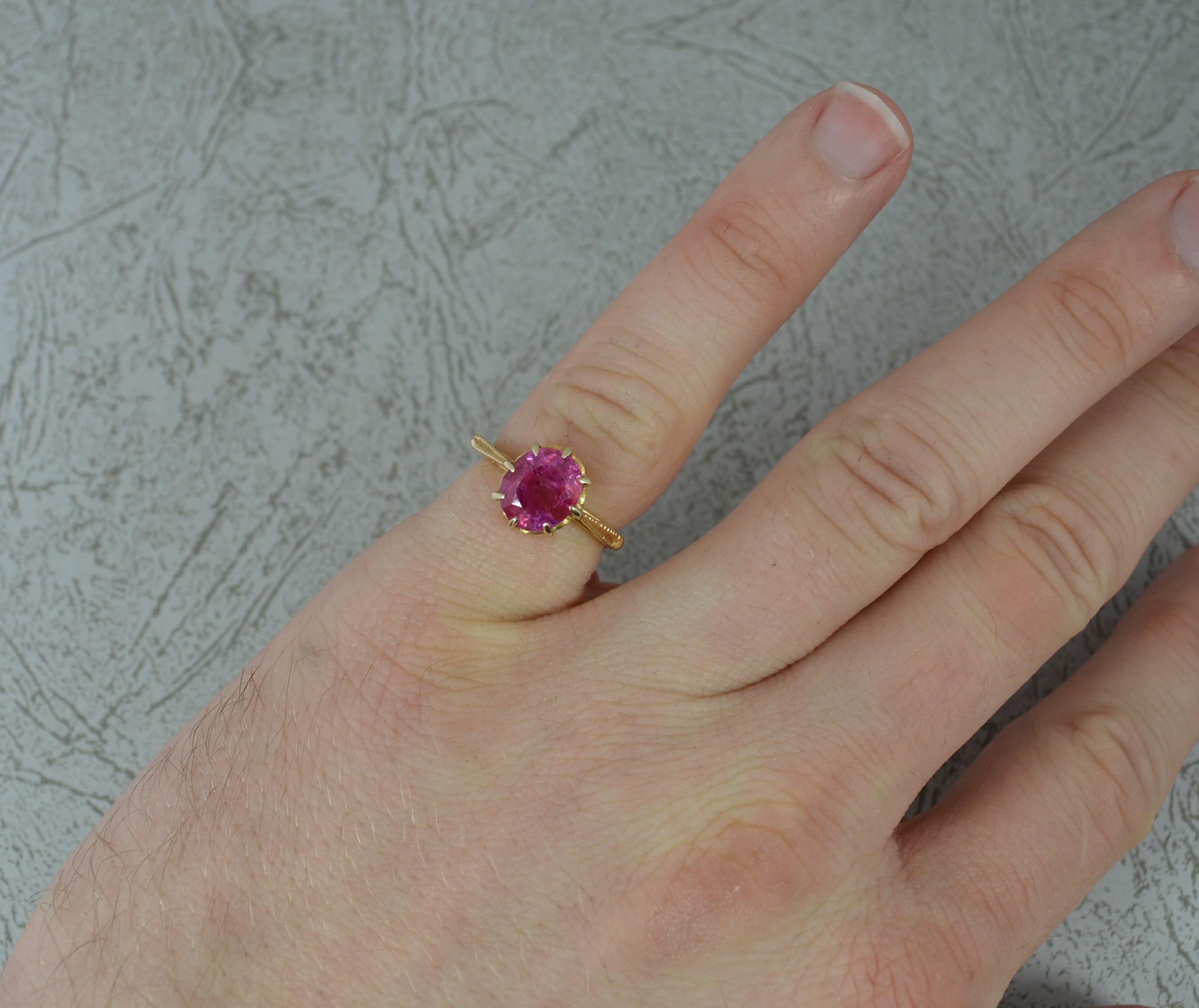 A beautiful ruby solitaire ring, circa 1890/1900.
Solid 18 carat yellow gold shank and claw setting.
Designed with an oval ruby to centre, 7.1mm x 8.5mm. A stunning colour. Rare untreated / heated natural ruby.
Protruding 6.2mm off the
