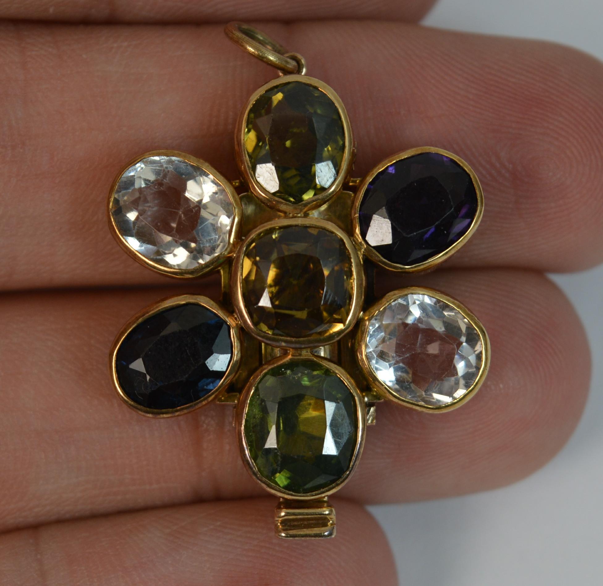 
A stunning antique rose gold and multi gemstone clasp and pendant.

Beautifully formed in a rich rose gold colour throughout with collet setting for each individual stone.

The piece formed as a flower head set with seven natural oval gemstones to