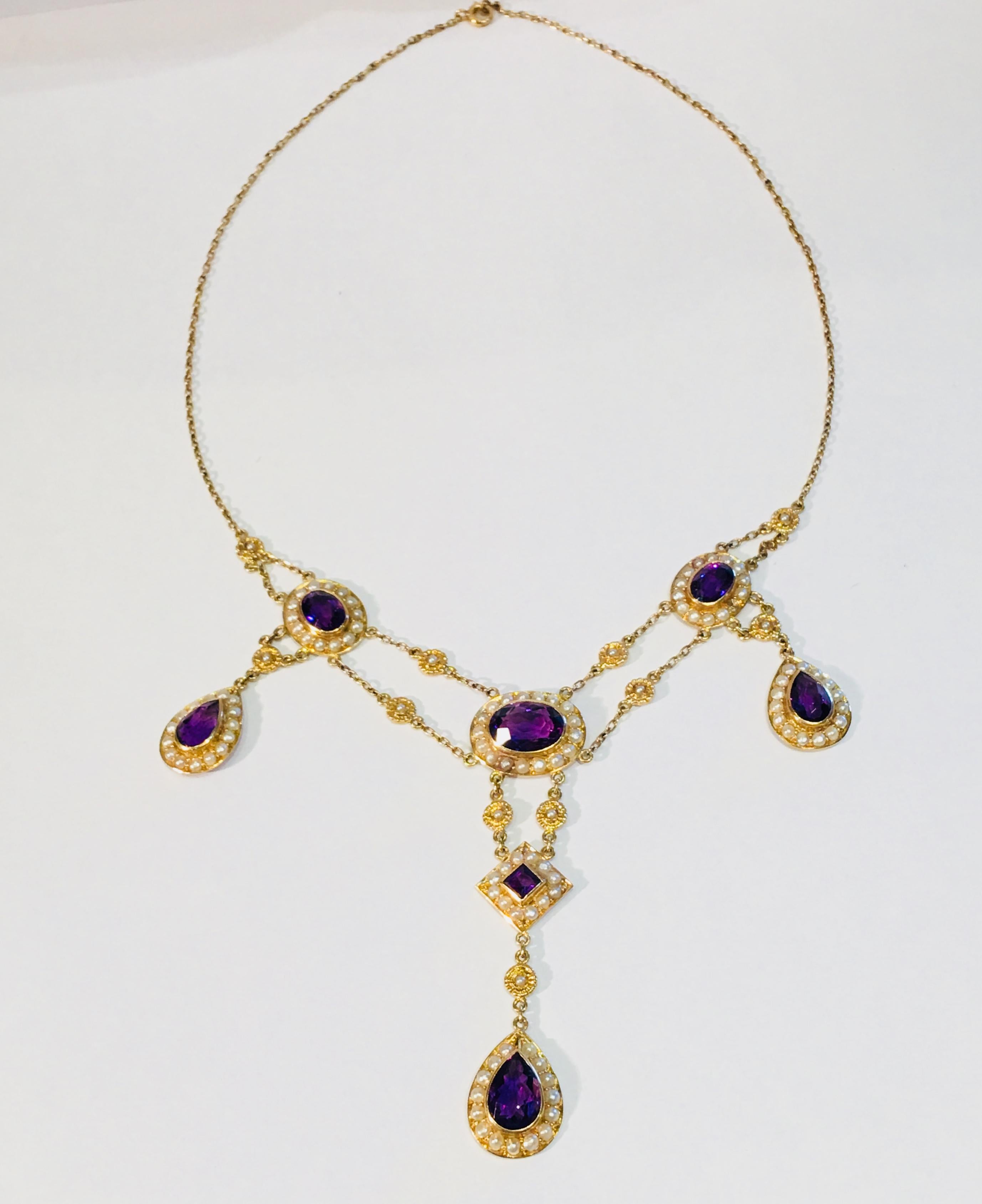 Elaborate, beautifully hand made vintage multi-strand 14 karat yellow gold chain necklace features over 9 carats of the finest quality Siberian amethysts in oval, pear and princess cuts, bezel set and surrounded by halos of seed pearls, and accented