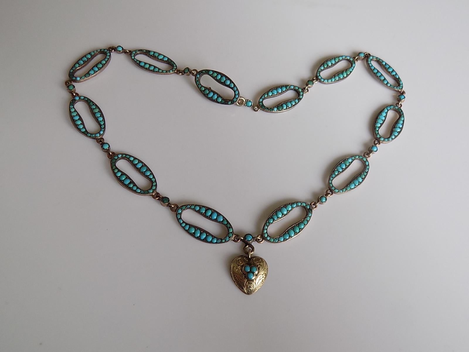 An Extremely rare and outstanding looking Victorian c.1880 Silver Gilt and Turquoise link designed necklace with a heart shaped pendant and hook fastener. The Turquoise stones in pave setting. Ideal as everyday or special occasion piece. 
Total