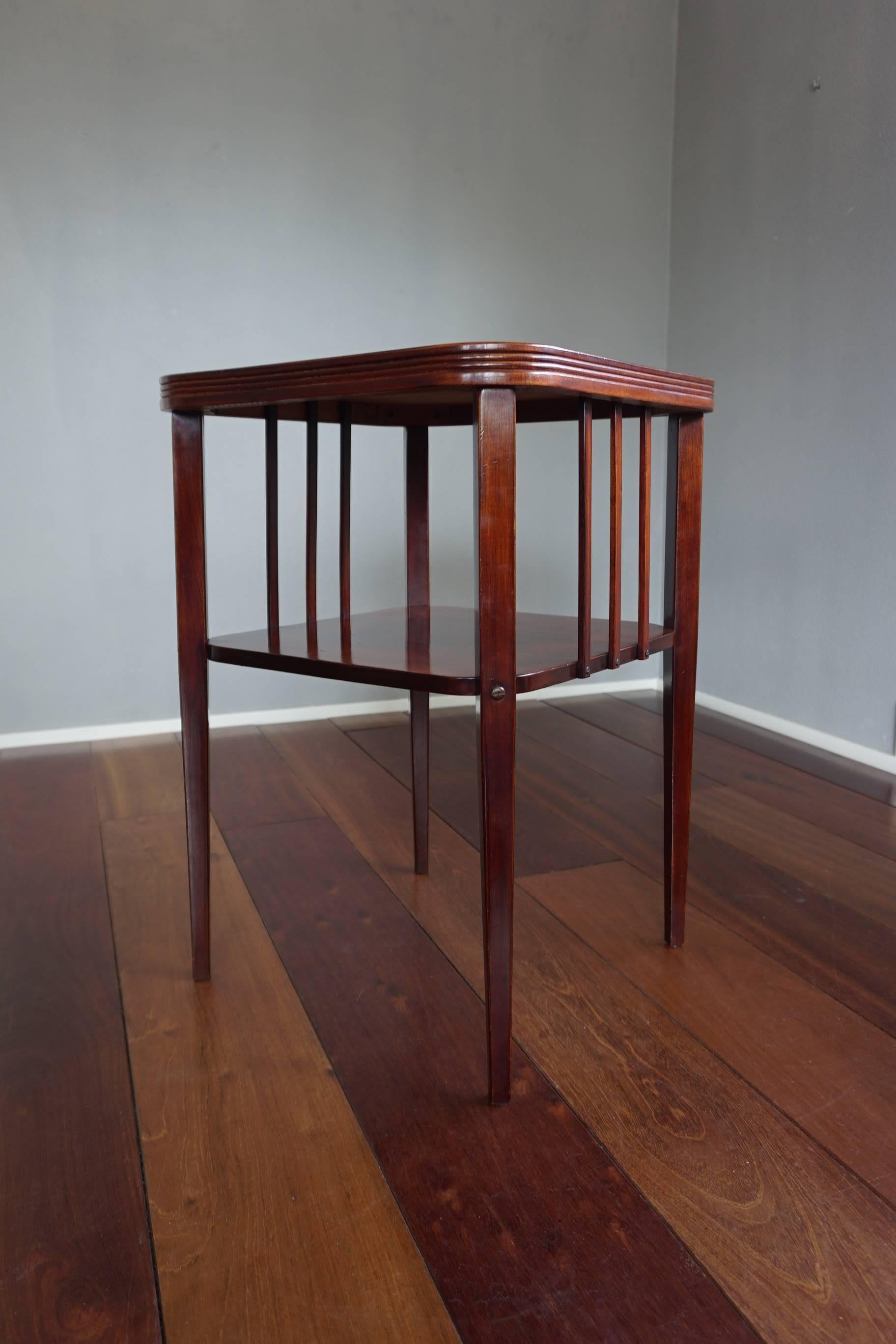 Thonet marked, highly stylish and functional table.

If ever there was a timeless design then this Viennese Secession table would be it. The perfect proportion, the open design, the perfect size and the beautiful color and materials make it an