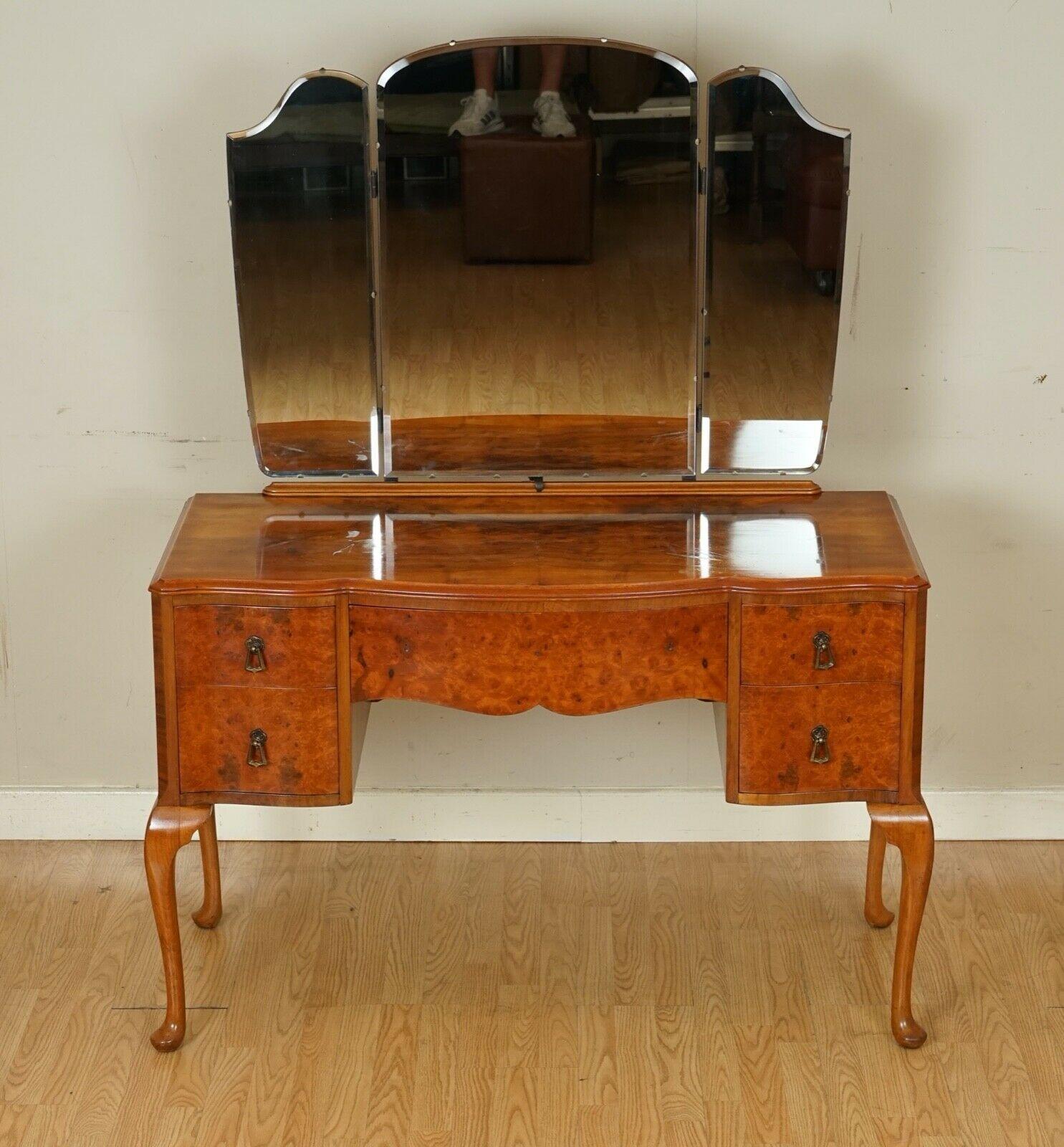 We are delighted to offer for sale this lovely vintage burr walnut dressing table.
A very lovely table with 5 drawers to store your belongings, triple mirrors which can be adjusted to your liking.
The top of the table has some wear as you will be