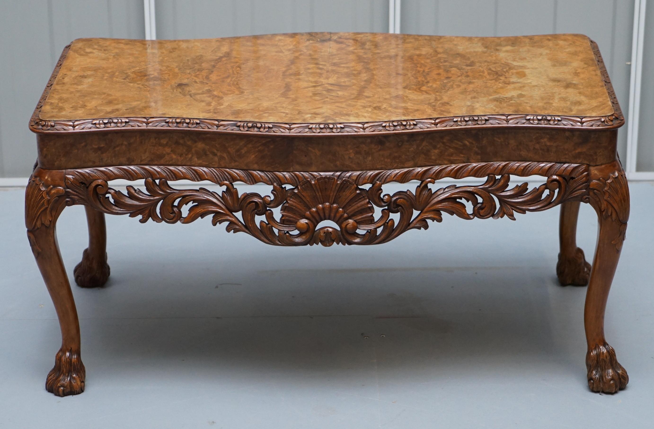 We  delighted to offer for sale this lovely vintage burr walnut coffee table with ornately carved frame and lion hairy paw feet

A very good looking well made and decorative table, the top has been used with a glass cover so its in perfect