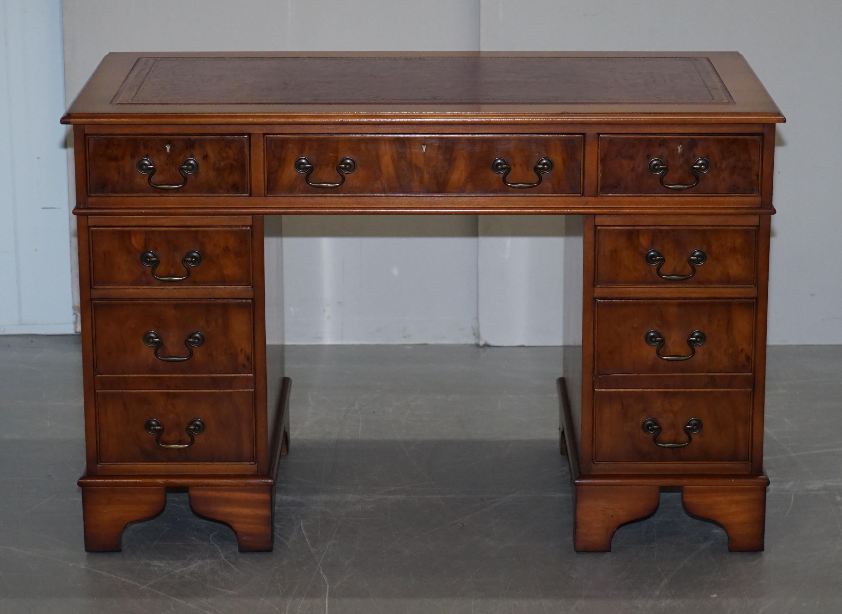 We are delighted to offer for sale this stunning vintage Burr Walnut twin pedestal partner desk with oxblood leather writing surface

A good looking well made and decorative desk, it splits into three pieces for ease of transport. The timber