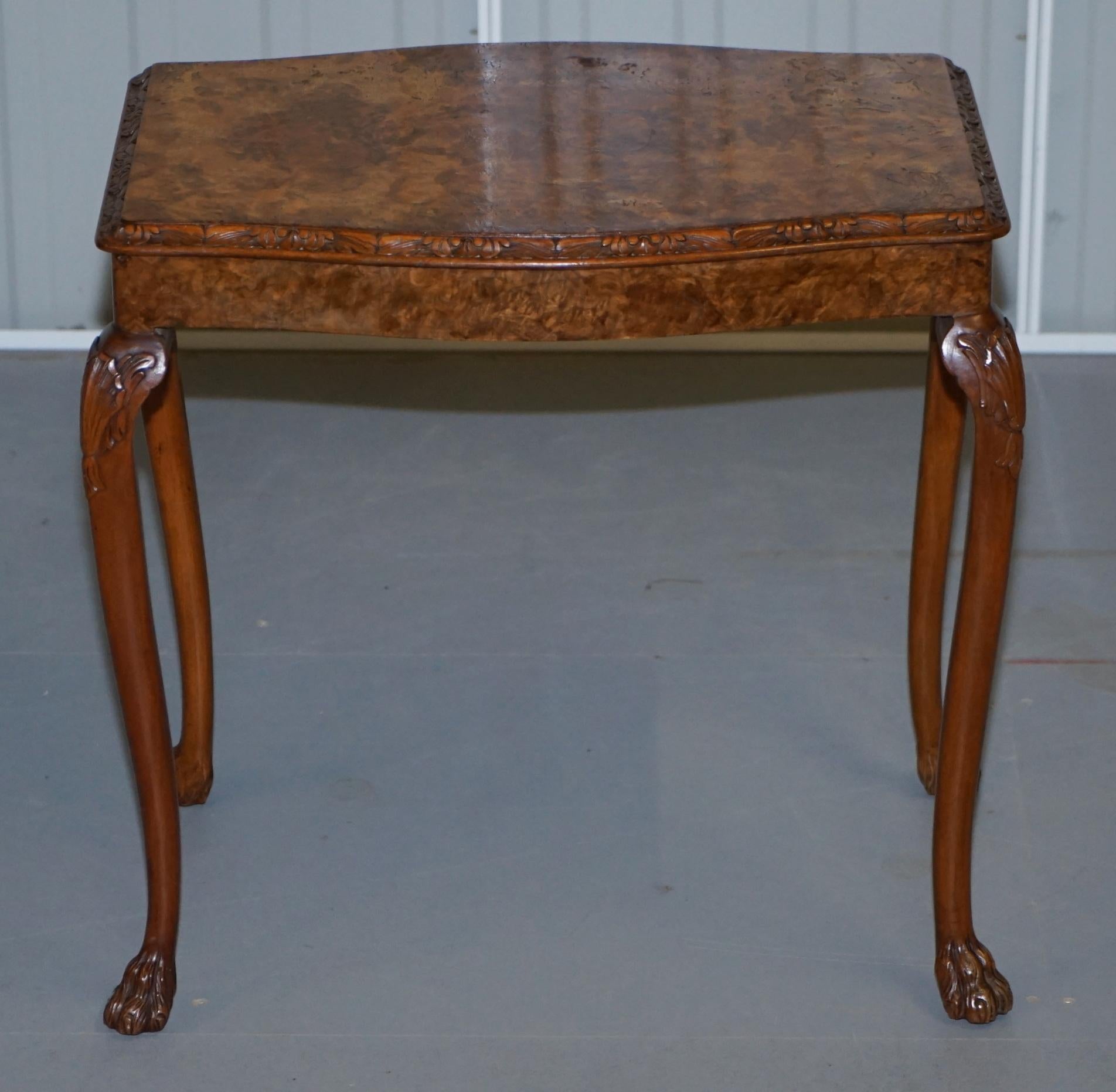 We are delighted to offer for sale this lovely vintage burr walnut side table with ornately carved frame and lion hairy paw feet

A very good looking well made and decorative table, it was originally a nested table but now is on its own, you can