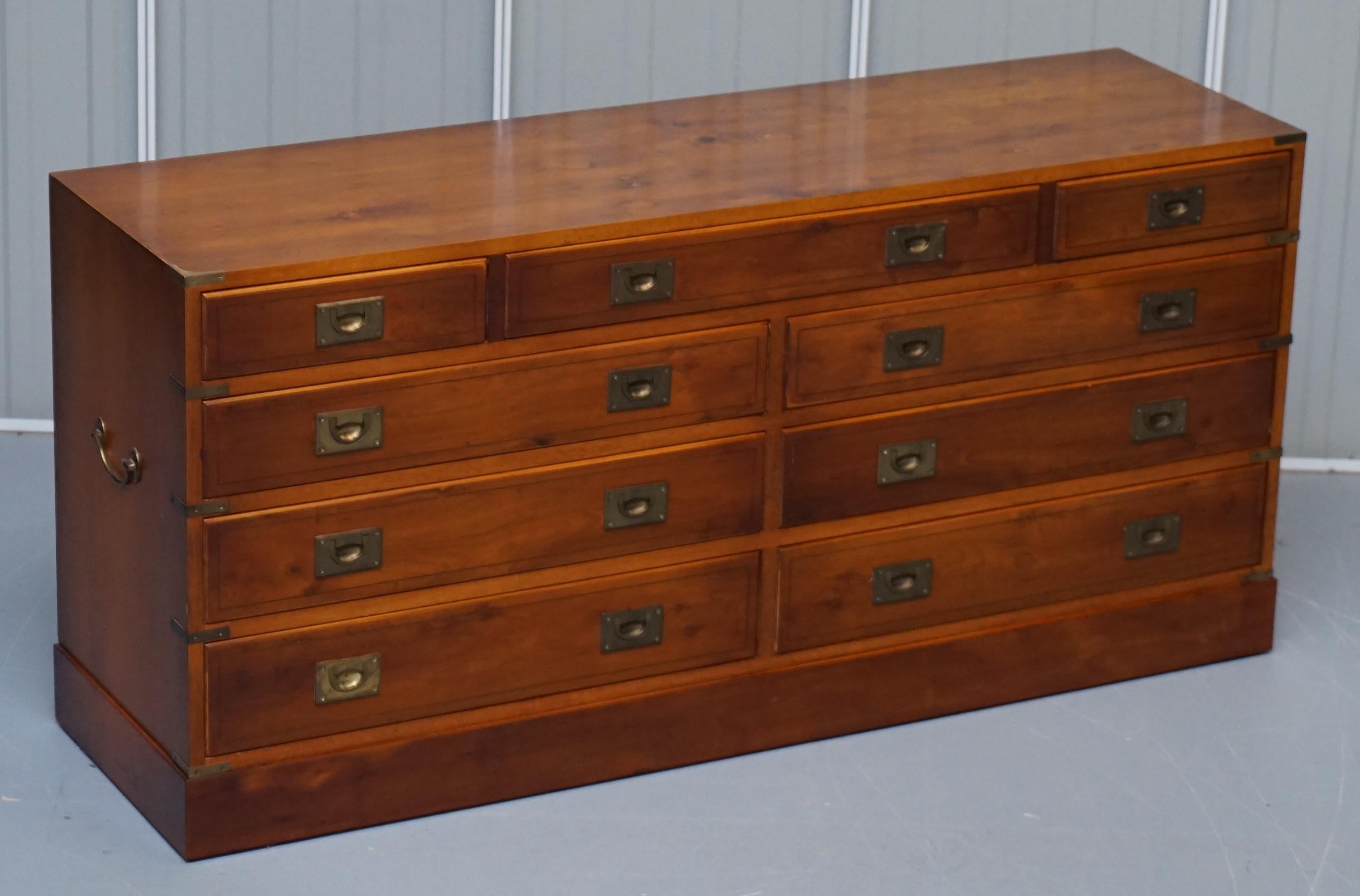 We are delighted to offer for sale this lovely lightly burred yew wood Military Campaign sideboard chest of drawers

A very good looking well made and desirable vintage sideboard, the Military Campaign style is a finish that will never go out of