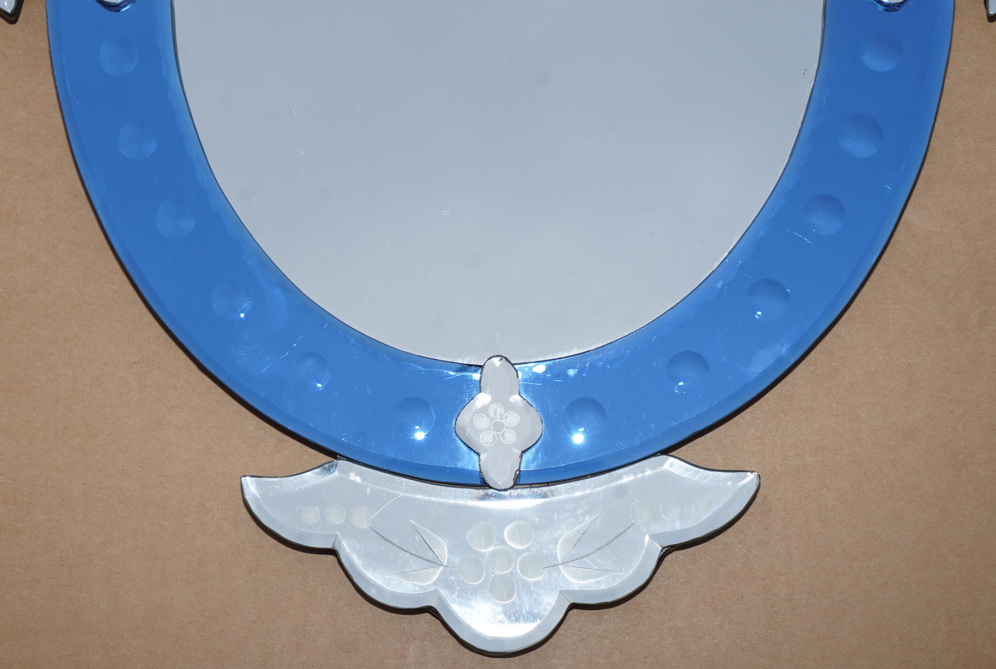 We are delighted to offer for sale this lovely vintage Cobalt blue, engraved and etched Italian Venitian wall mirror

A very good looking and decorative mirror, it has Cobalt blue panels which first came to England in the Victorian era in small